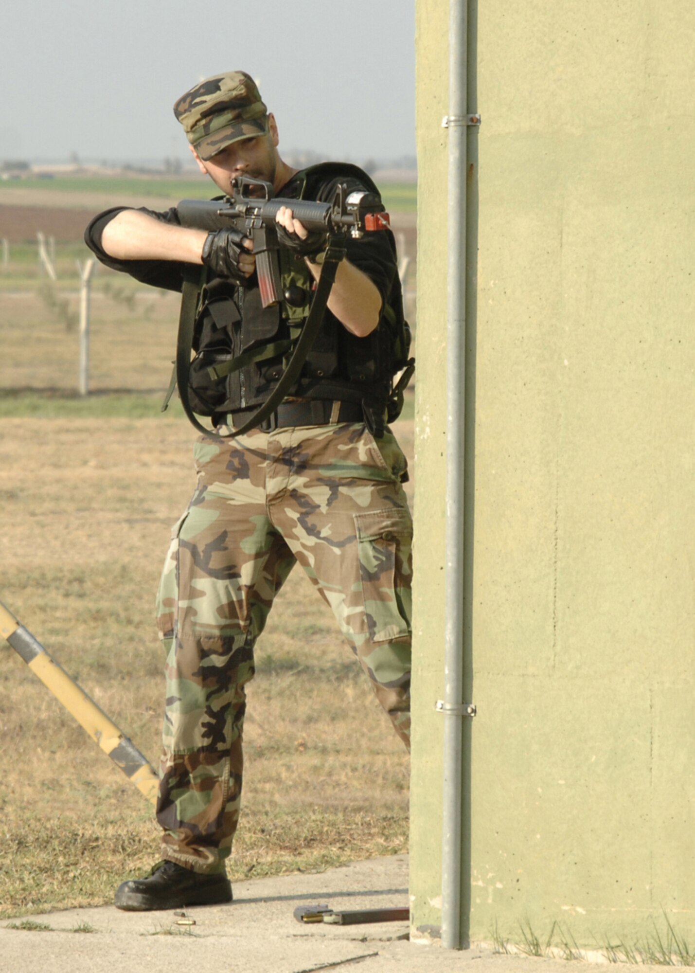 Staff Sgt. Lucas Sanders, 39th Maintenance Squadron conventional stockpile management supervisor, prepares to fire his weapon during a force on force recapture exercise Aug. 21. Sergeant Sanders was one of the Airmen who volunteered their time to be the aggressors. (U.S. Air Force photo by Senior Airman Tiffany Colburn)(RELEASED)