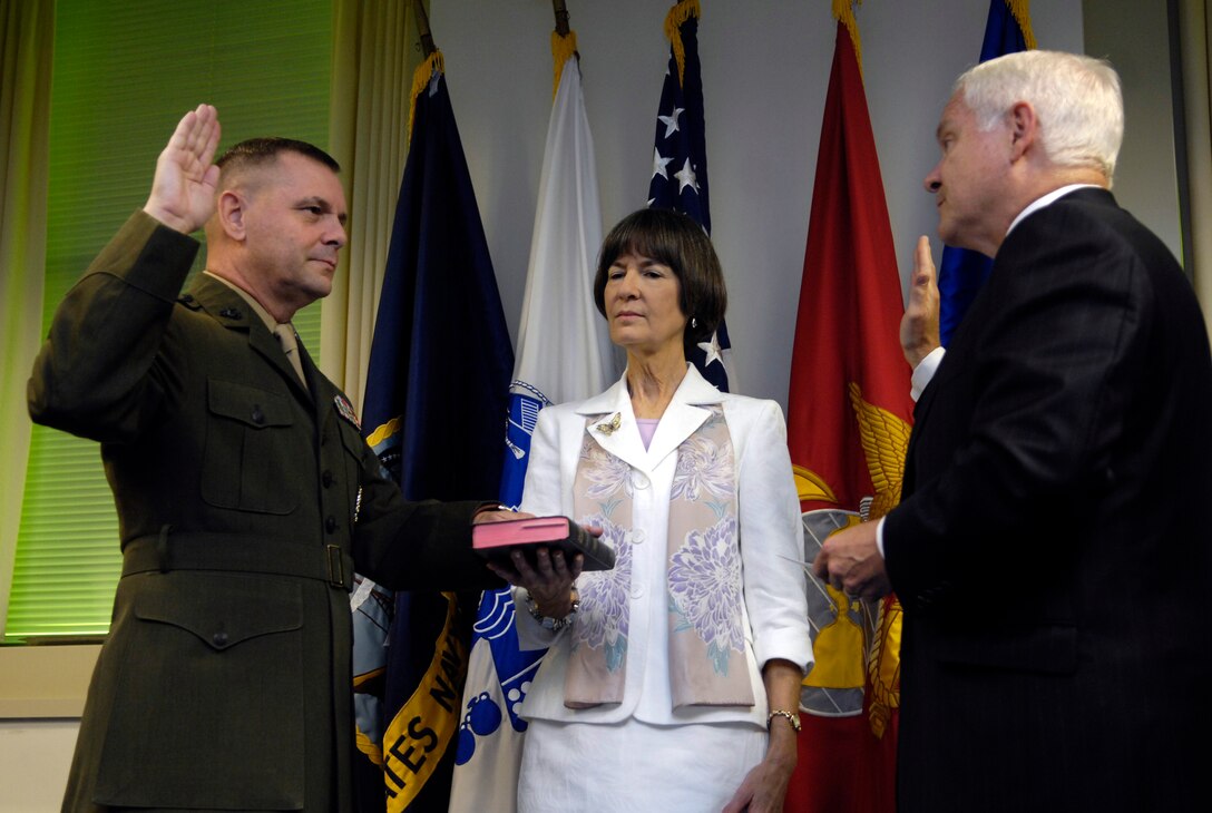 Marine Gen. James E. Cartwright takes the oath of office as vice chairman of the Joint Chiefs of Staff from Defense Secretary Robert M. Gates with the assistance of his wife, Sandee Cartwright, at the Pentagon, Aug. 31, 2007. Photo by Cherie A. Thurlby