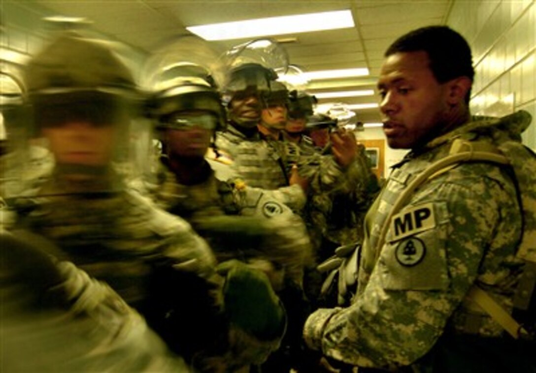 A U.S. Army soldier practices facing movements with the 130th Military Police Company, Tennessee Army National Guard during training at the Muscatatuck Urban Training Center, Ind., Aug. 25, 2007. 