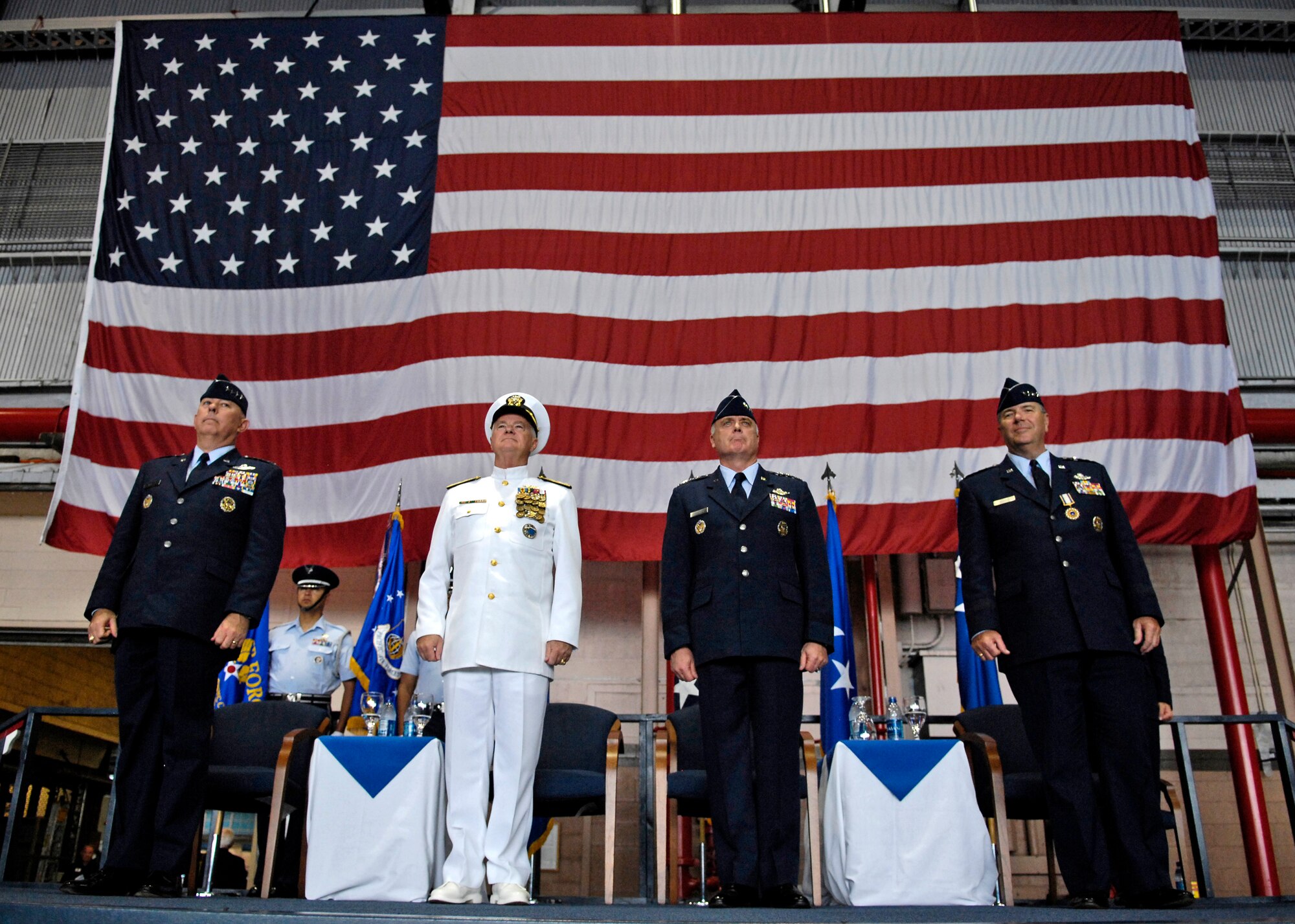 Gen. T. Michael Moseley, Chief of Staff, U.S. Air Force, Adm. Timothy J. Keating, Commander U.S. Pacific Command, Gen. Carrol H. Chandler, in coming Pacific Air Forces commander and Gen. Paul V. Hester, outgoing PACAF commander stand during the Air Force song Nov. 30 during the PACAF change of command ceremony at Hickam Air Force Base, Hawaii. Gen. Moseley and Adm. Keating presided over the change of command. Gen. Chandler assumed command of PACAF during the ceremony. (U.S. Air Force photo/Tech. Sgt. Shane A. Cuomo)