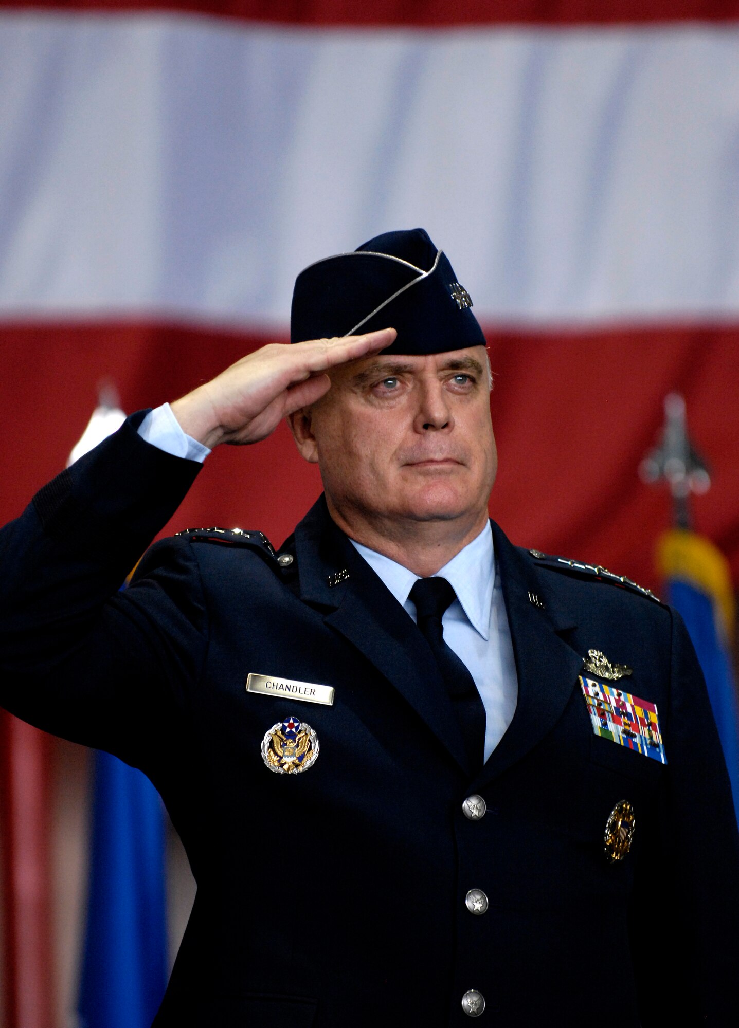 Gen. Carrol H. Chandler receives his first salute from the Airmen of Pacific Air Forces Nov. 30 during his change of command ceremony at Hickam Air Force Base, Hawaii. Gen. T. Michael Moseley, Chief of Staff, U.S. Air Force and Adm. Timothy J. Keating, Commander U.S. Pacific Command presided over the change of command. Gen. Chandler assumed command of PACAF from Gen. Paul V. Hester during the ceremony. (U.S. Air Force photo/Tech. Sgt. Shane A. Cuomo)