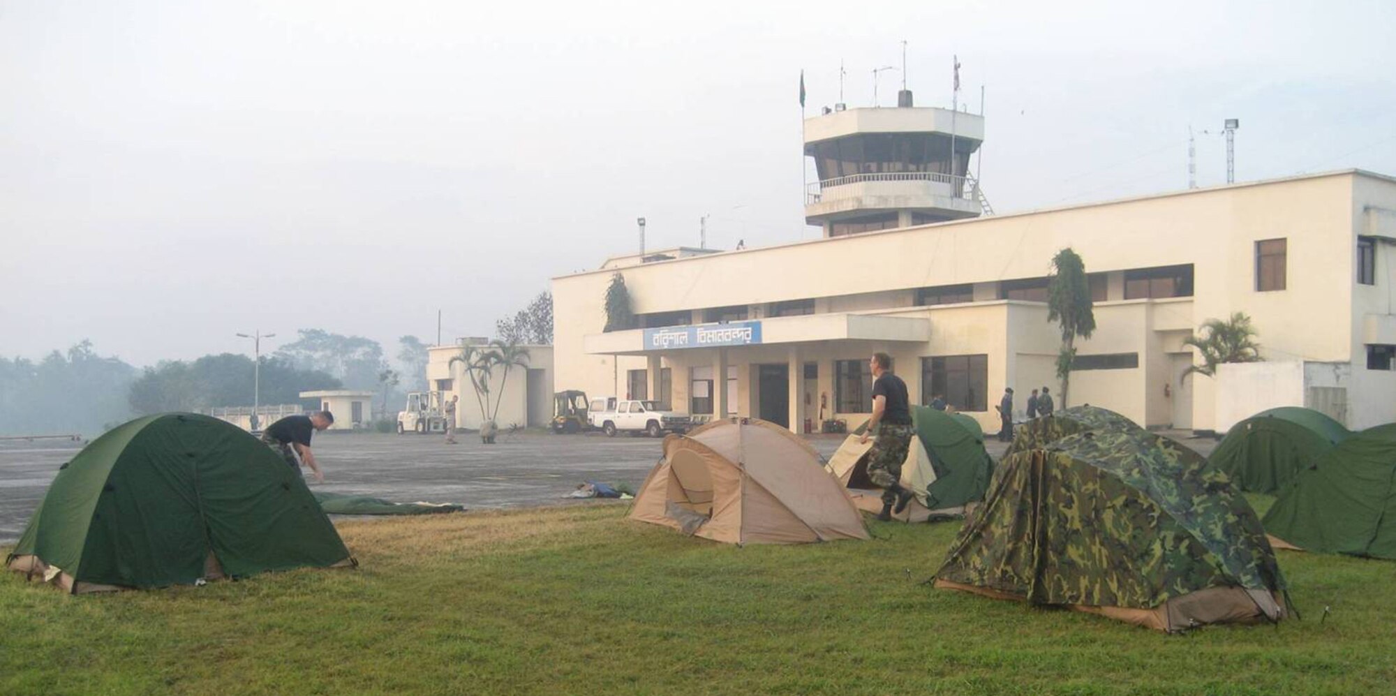 Members of the 36th Contingency Response Group set up tents on the helicopter landing zone along the parking ramp to beddown for the night.  The team packs up camp every morning before aircraft arrive. (Courtesy photo)
