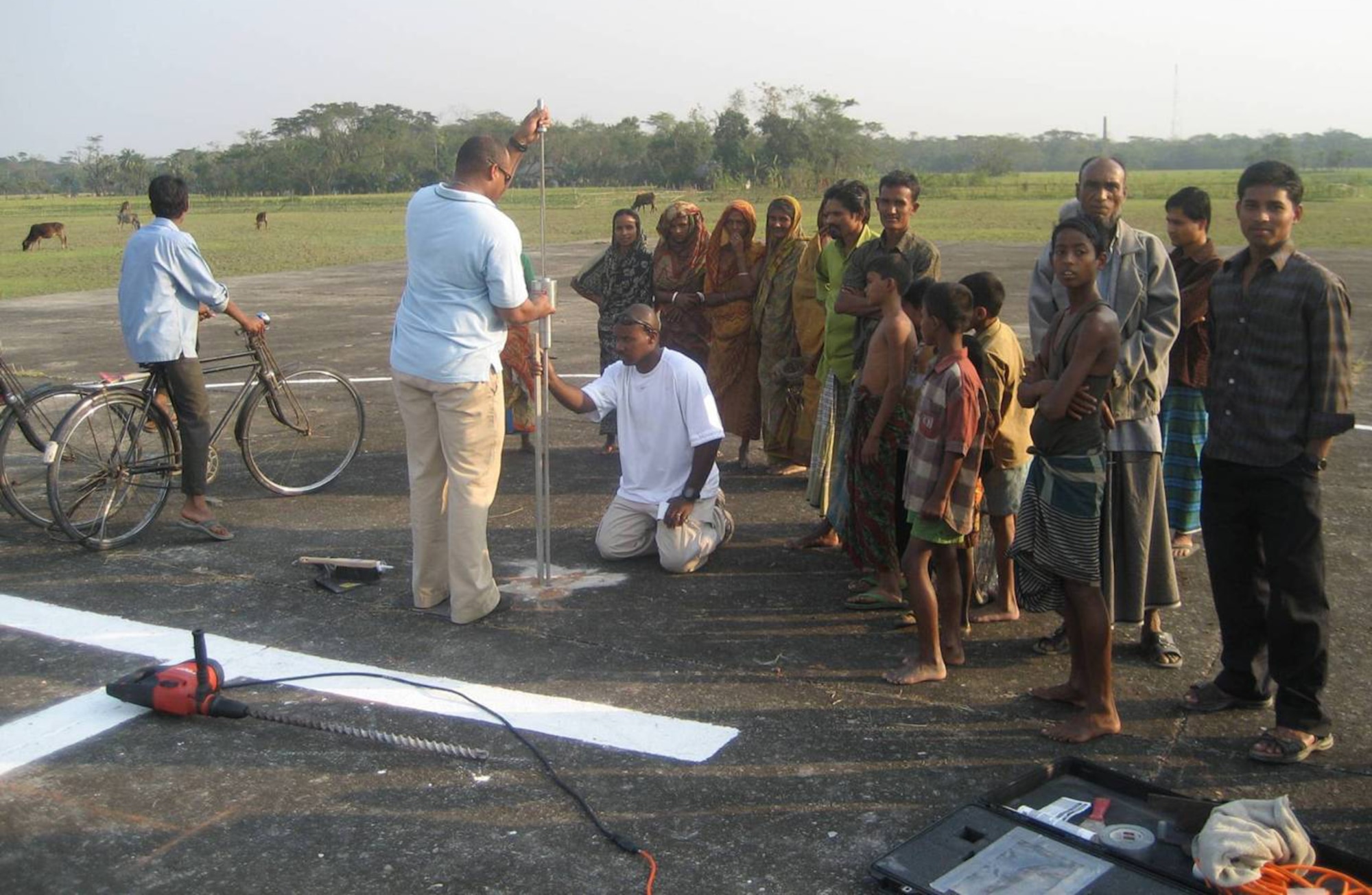 Members of the 36th Contingency Response Group organize airfield operations.  Teams down load a C-130 and simultaneously work with the Bangladesh Army to load two CH-46 with relief supplies; all three aircraft were able to depart the airfield within 10 minutes. (Courtesy photo)