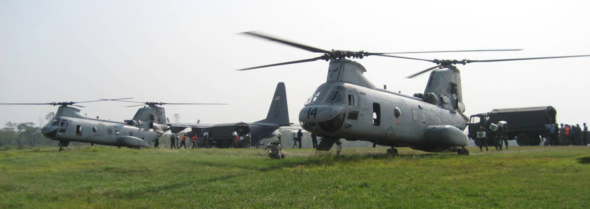 Members of the 36th Contingency Response Group organize airfield operations.  Teams down load a C-130 and simultaneously work with the Bangladesh Army to load two CH-46 with relief supplies; all three aircraft were able to depart the airfield within 10 minutes. (Courtesy photo)