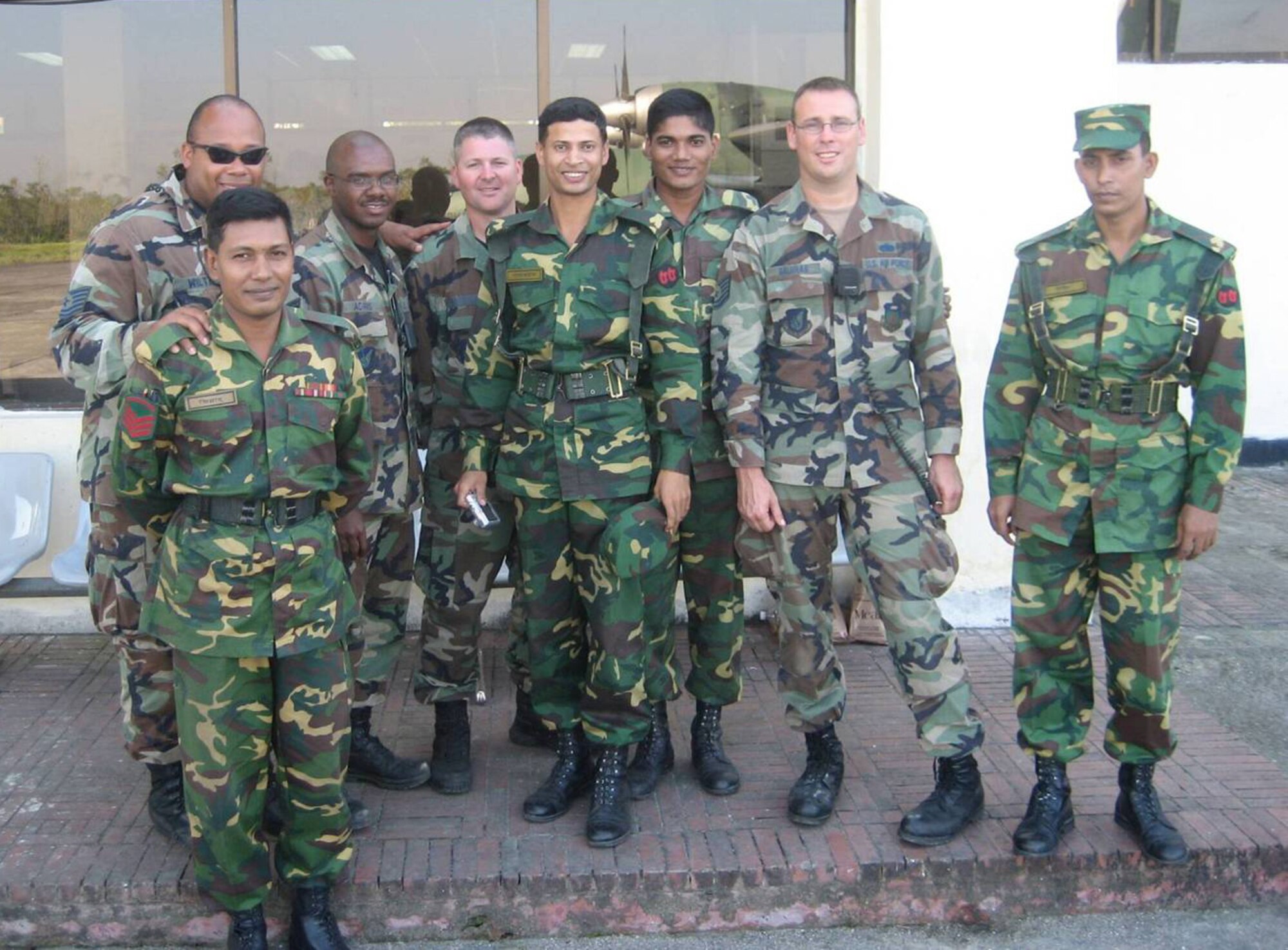 After completing the airfield assessment, Tech. Sgt. Darrol Wiltz, Staff Sgt. Tyler Adams, Master Sgt. Jon Harston and Tech. Sgt. Timothy Galunas take a moment to get a picture with their Bangladesh Army counterparts.   (Courtesy photo)