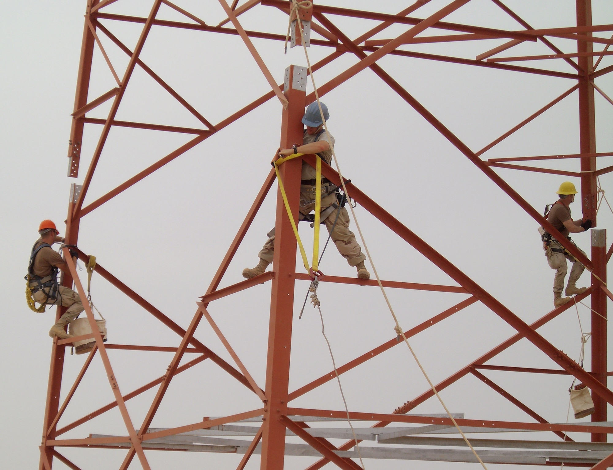 A special Central Command Air Forces maintenance team works to install a portion of a Radio-over-Internet Protocol Routed network, or RIPRnet, communications tower at Ali Base, Iraq. The tower is part of a core site for the RIPRnet. (U.S. Air Force photo)