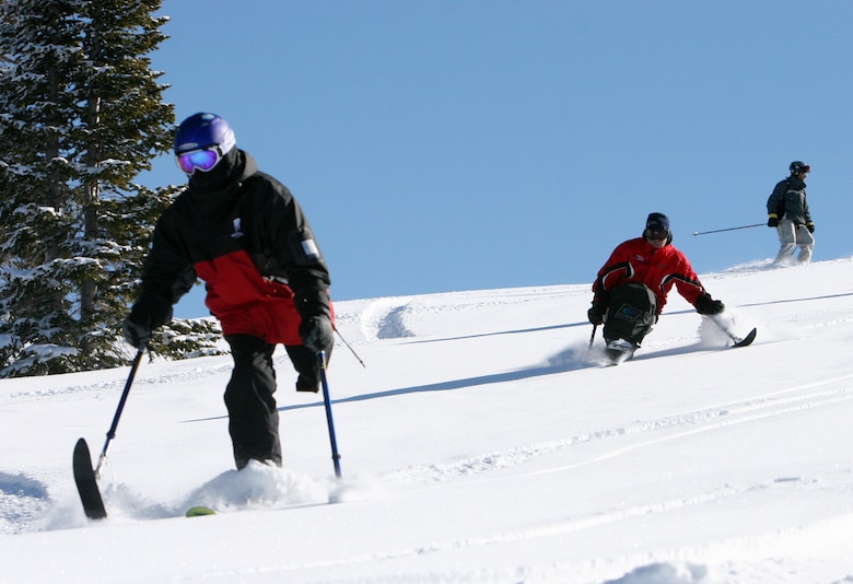 Ed Salau, followed by Adaptive Adventures program director Matt Feeney, carve some turns last winter at Steamboat. Wounded warriors, injured while fighting the Global War on Terrorism in Iraq or Afghanistan, will attend SnoFest this year and learn to ski within the limitations of their disabilities. (Courtesy photo)