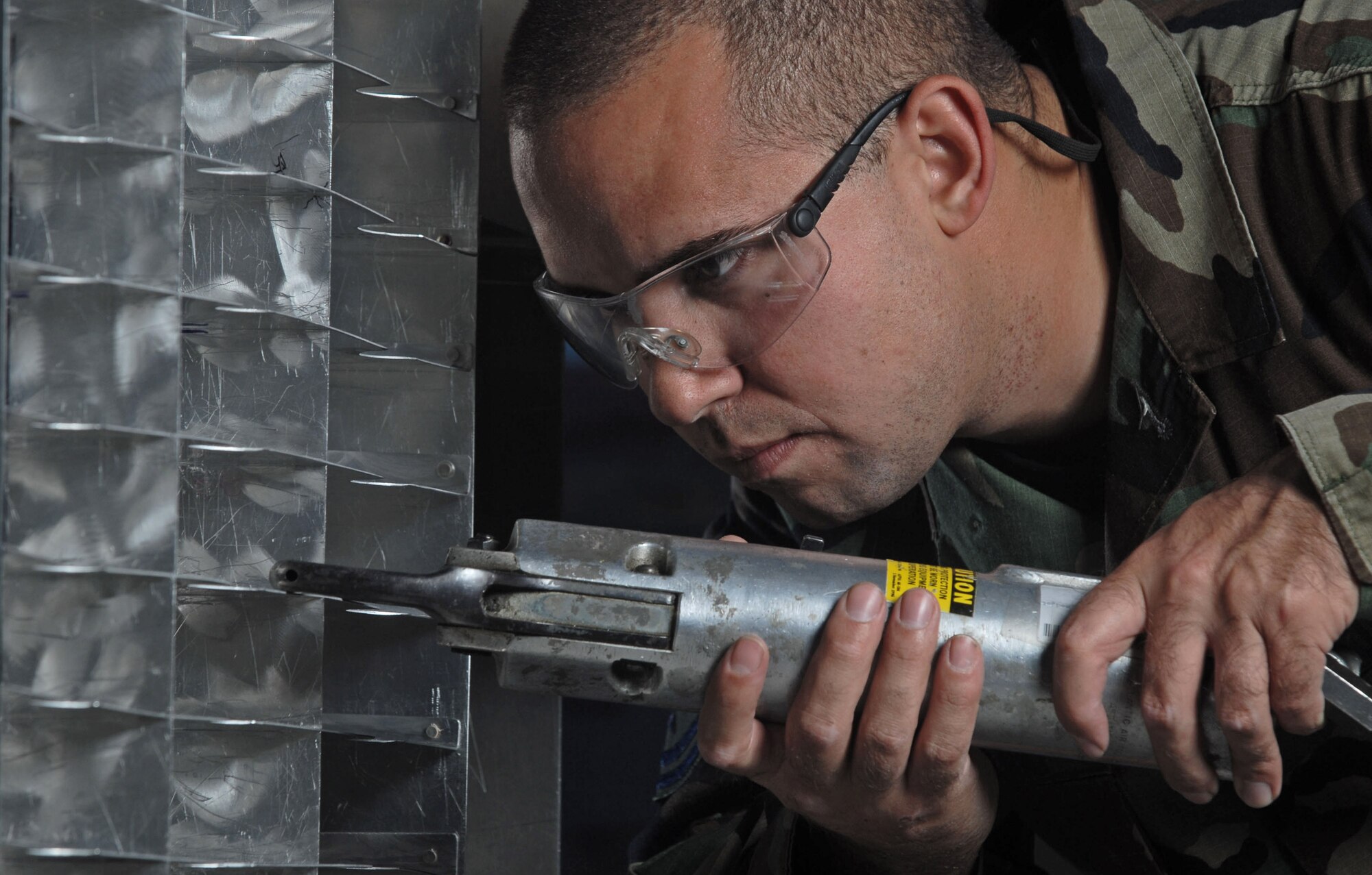 Tech. Sgt. Brad Rosario uses a rivet squeezer on a KC-135 Stratotanker technical order cabinet while modifying the cabinet Nov. 28 at March Air Reserve Base, Calif. In addition to being the home of the Air Force Reserve Command's largest air mobility wing, the base hosts units from the Army, Navy and Marine Corps Reserve, and the Air National Guard. Sergeant Rosario is an aircraft structural maintenance technician from the 452nd Maintenance Squadron. (U.S. Air Force photo/Val Gempis) 