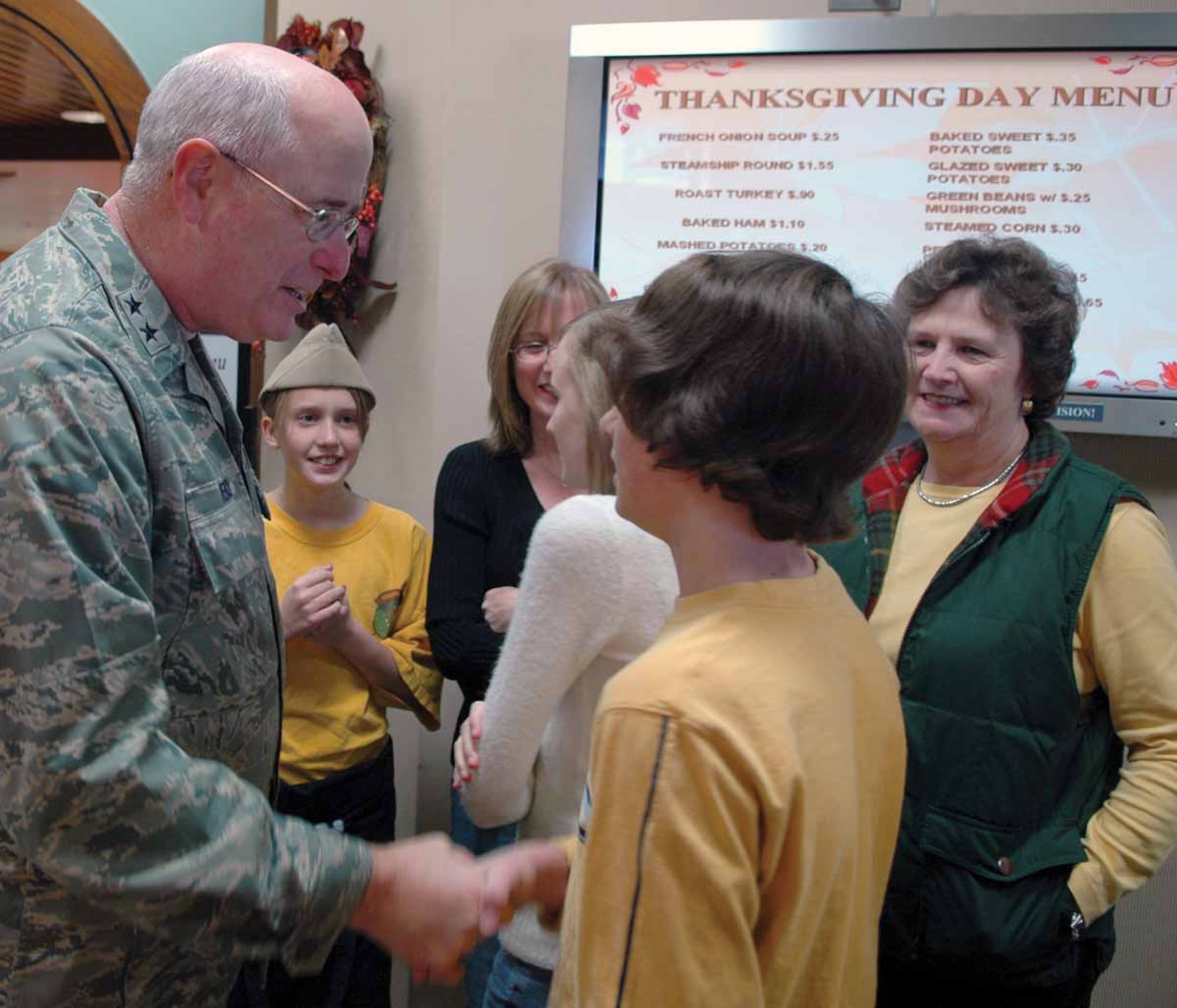Maj. Gen. Loren Reno, Oklahoma City Air Logistics Center commander, greets guests upon their arrival at the Vanwey Dining facility for dinner.  (Air Force photo by Kathy Paine)