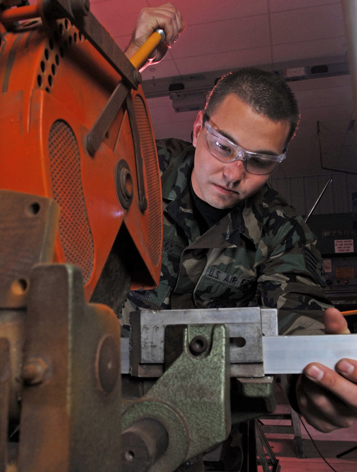 Staff Sgt. Greg Boggs adjusts a chop saw before cutting a piece of extrusion Nov. 28 that will be used for a repair on a KC-135 Stratotanker aircraft at March Air Reserve Base, Calif.  In addition to being the home of the Air Force Reserve Command's largest air mobility wing, the base hosts units from the Army, Navy and Marine Corps Reserve, and the Air National Guard. Sergeant Boggs is an aircraft structural maintenance technician from the 452nd Maintenance Squadron. (U.S. Air Force photo/Val Gempis) 