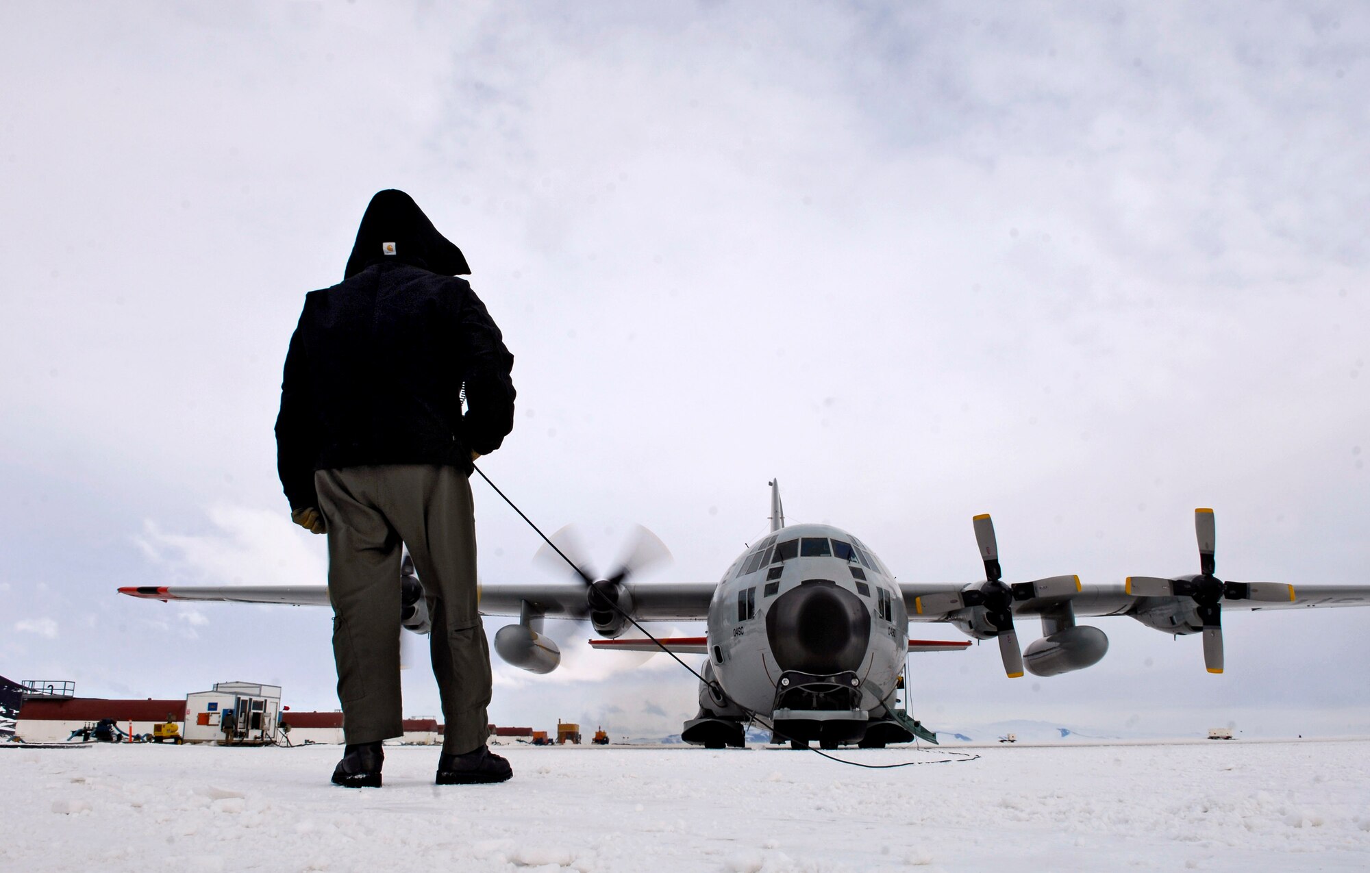 Chief Master Sgt. Bill Nolin conducts pre-flight checks on an LC-130 Hercules Nov. 26 at the annual sea ice runway near McMurdo Station, Antarctica, during Operation Deep Freeze. Ski-equipped LC-130s, crews and support personnel from the New York Air National Guard's 109th Airlift Wing are supporting the 13th Air Force-led Joint Task Force Support Forces Antarctica, Operation Deep Freeze. Operation Deep Freeze is a unique joint and total force mission that has supported the National Science Foundation and U.S. Antarctic Program that began in 1955. (U.S. Air Force photo/Tech. Sgt. Shane A. Cuomo) 