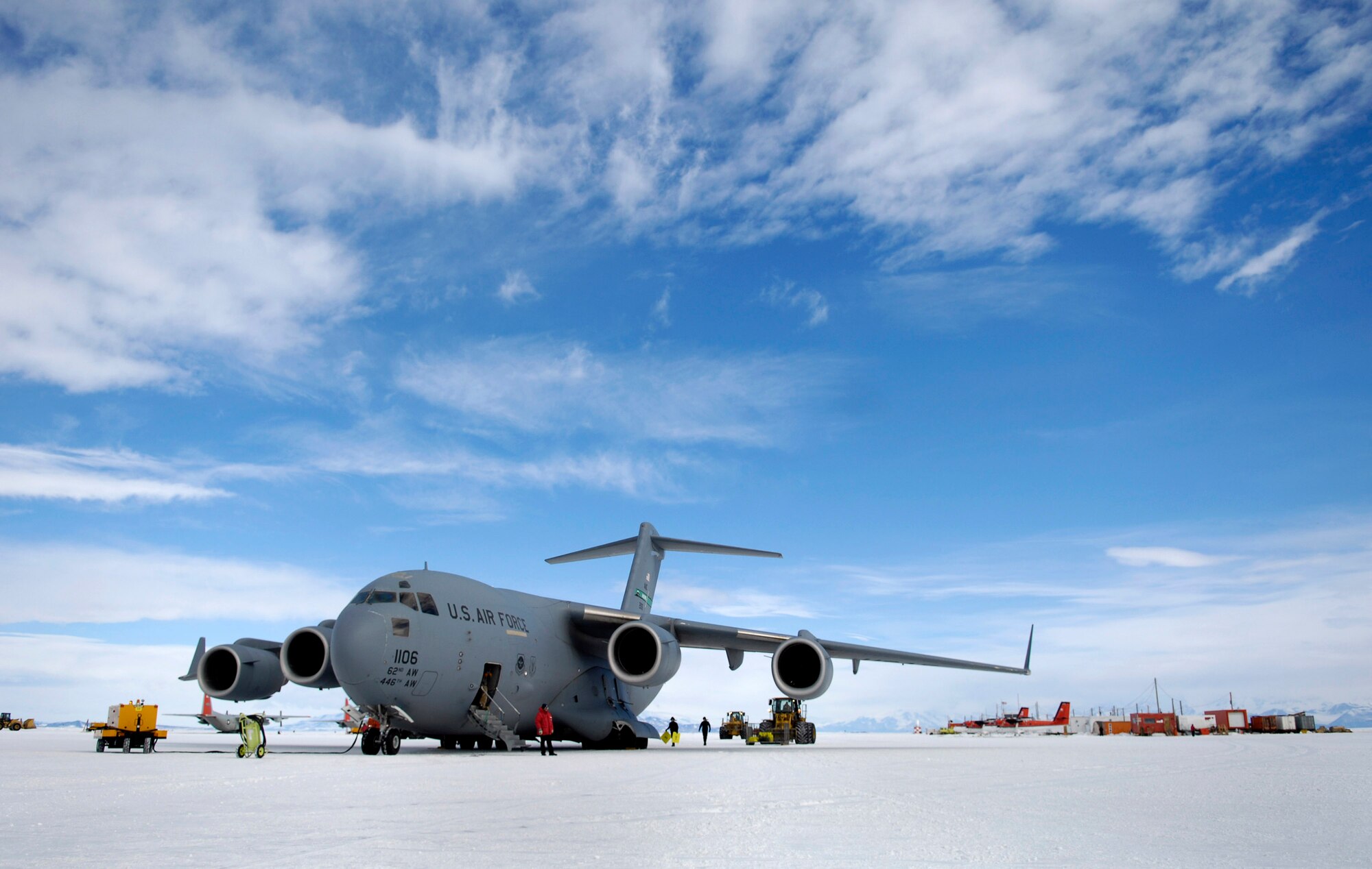 A C-17 Globemaster III is offloaded on the annual sea ice runway Nov. 26 near McMurdo Station, Antarctica, during Operation Deep Freeze. C-17s fly large cargo loads from Christchurch, New Zealand, to Antarctica while the LC-130 Hercules, stationed at McMurdo, fly smaller cargo loads to research posts throughout the continent. The C-17s from McChord Air Force Base, Wash., and ski-equipped LC-130s from the New York Air National Guard's 109th Airlift Wing are supporting the 13th Air Force-led Joint Task Force Support Forces Antarctica, Operation Deep Freeze. Operation Deep Freeze is a unique joint and total force mission that has supported the National Science Foundation and U.S. Antarctic Program that began in 1955. (U.S. Air Force photo/Tech. Sgt. Shane A. Cuomo) 