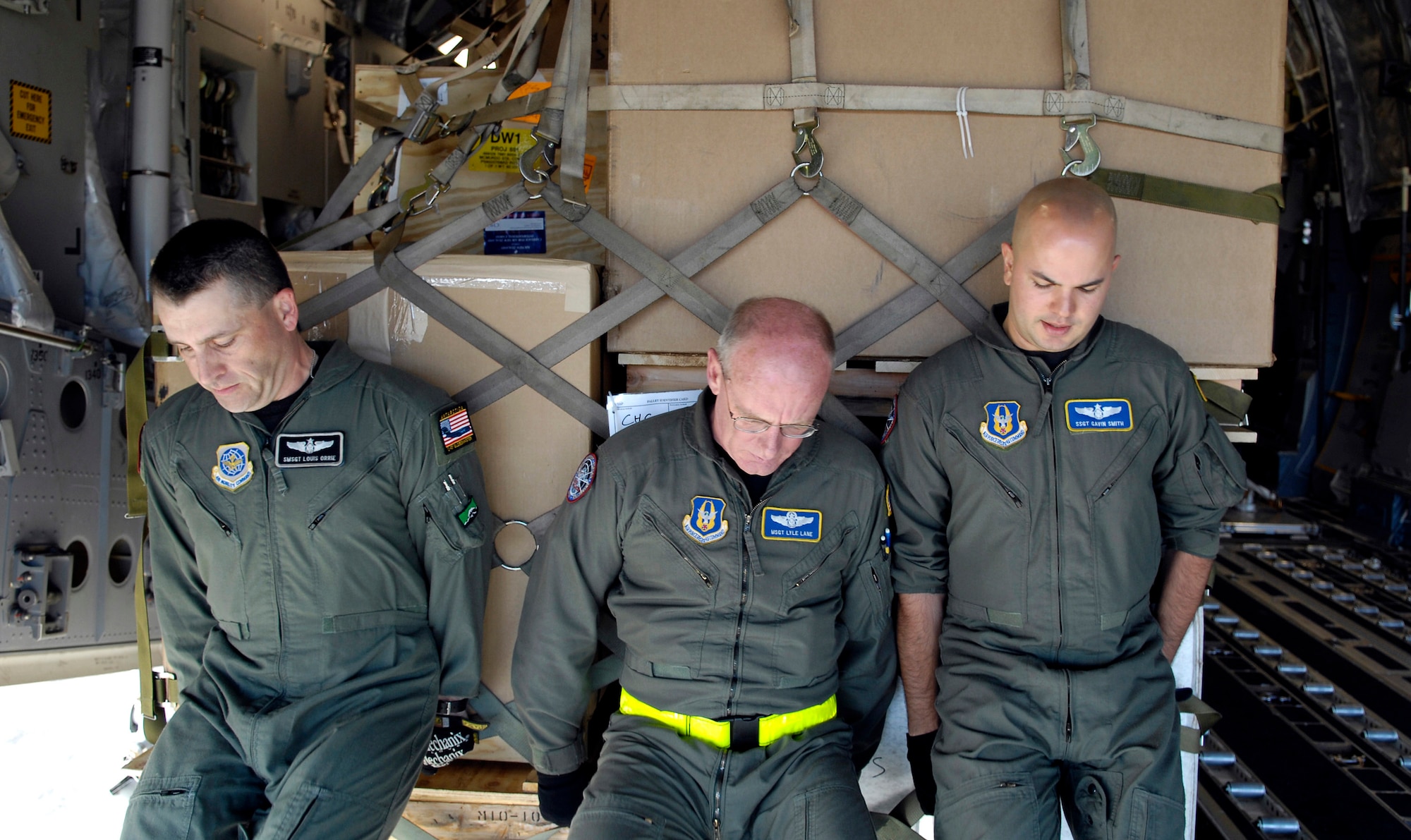 Senior Master Sgt. Louis Orrie, Master Sgt. Lyle Lane and Staff Sgt. Gavin Smith push a pallet onto their C-17 Globemaster III prior to taking off Nov. 26 from Christchurch, New Zealand, during Operation Deep Freeze. The Airmen, loadmaster, along with other Reserve and active duty Airmen from McChord Air Force Base, Wash., are at Christchurch supporting the 13th Air Force-led Joint Task Force Support Forces Antarctica, Operation Deep Freeze. Operation Deep Freeze is a unique joint- and total-force mission that has supported the National Science Foundation and U.S. Antarctic Program that began in 1955. (U.S. Air Force photo/Tech. Sgt. Shane A. Cuomo) 