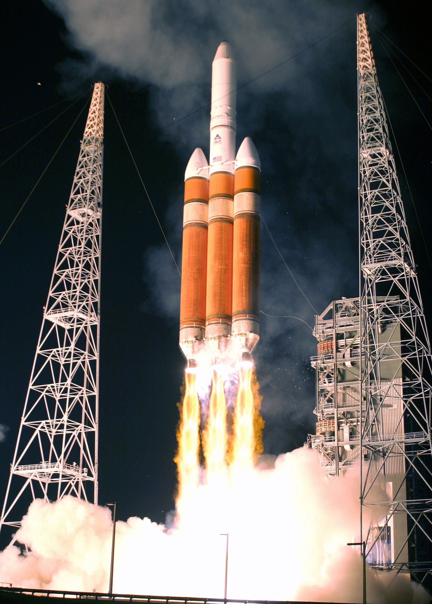 CAPE CANAVERAL, Fla. -- Defense Support Program Flight 23 takes off into the night Nov. 10 aboard Boeing's new Delta IV Heavy Evolved Expendable Launch Vehicle. Flight 23 marked the end of a 36-year era of DSP satellites. The program will be succeeded by the Space-Based Infrared System program.