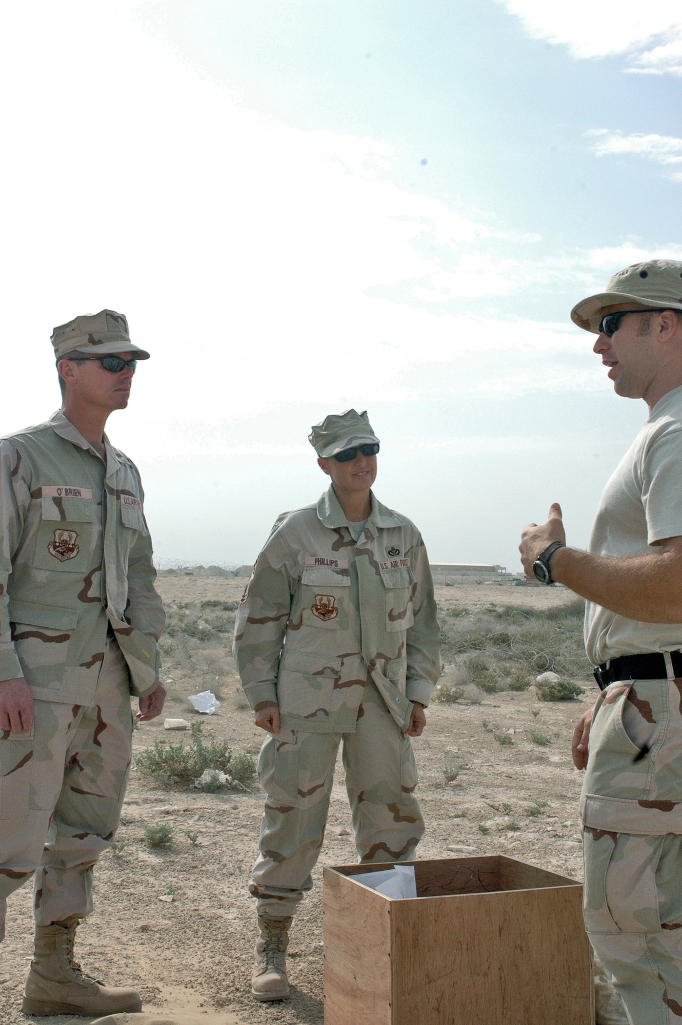 Chief Master Sgts. John O'Brien (left) and Suzanne Phillips, from the 379th Expeditionary Civil Engineer Squadron, are briefed by Tech. Sgt. David Fitzgerald  of the 379th ECES's explosive ordnance disposal branch about how EOD Airmen perform their duties and what their mission is here.  (U.S. Air Force photo/Staff Sgt. Jason Barebo)
