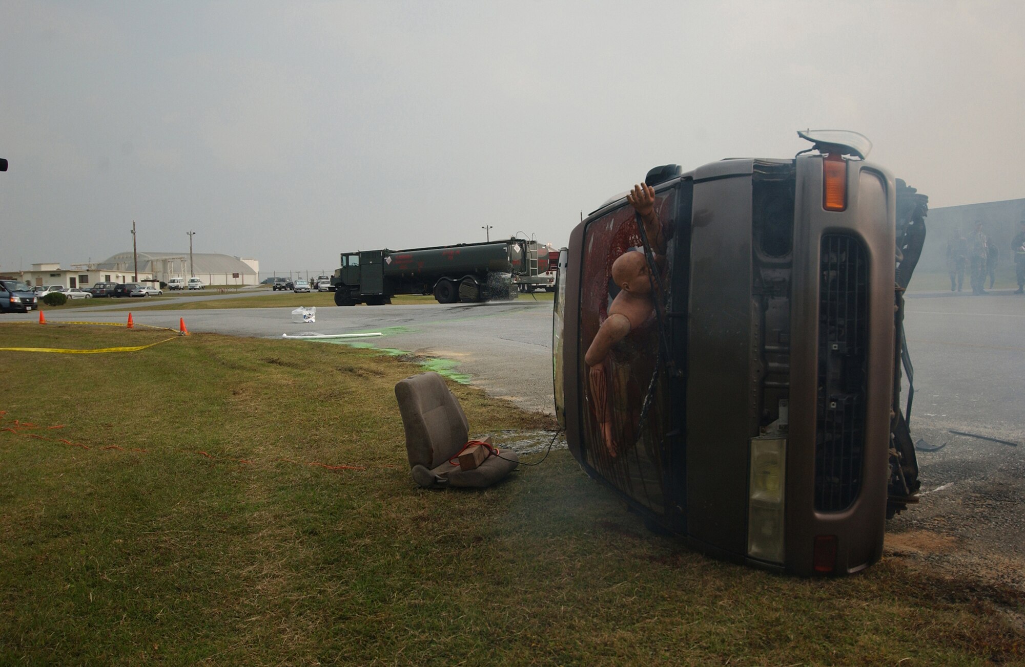 Base emergency response personnel respond to a simulated collision of a privately owned vehicle and an Air Force fuel truck during Local Operational Readiness Exercise Beverly High 08-2 at Kadena Air Base, Japan, Dec. 3, 2007. This scenario was conducted to test emergency crew members' response time to possible real-world situations and help Airmen heighten readiness capabilities.
(U.S. Air Force photo/Tech. Sgt. Rey Ramon)
