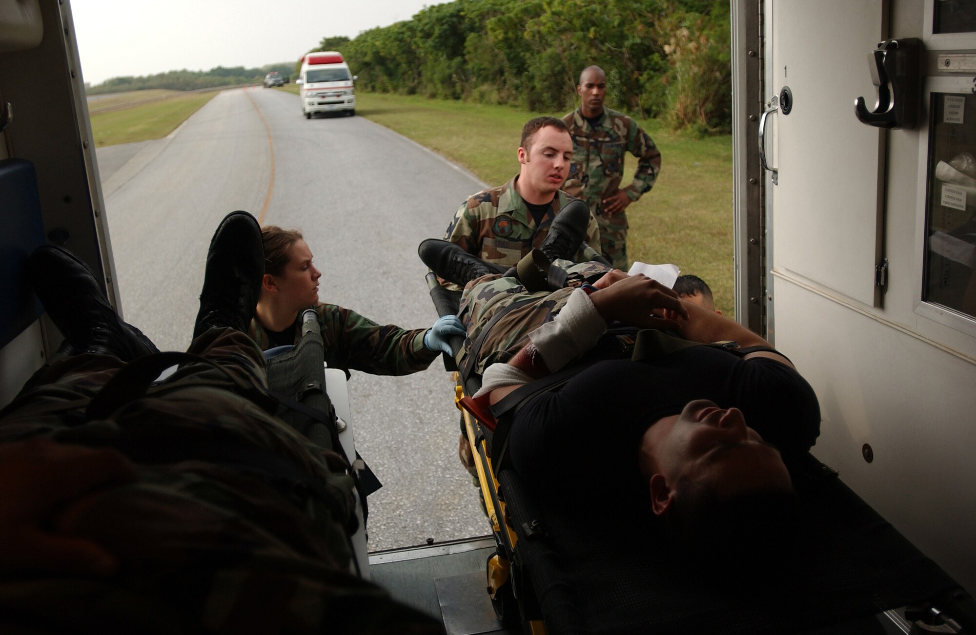 Airman 1st Class Michael Stull, 18th Aerospace Medicine Squadron and Senior Ariman Ashley Sard, 18th Medical Operations Squadron, place an injured victim in an ambulance before sending him to the emergency room during a simulated collision of a van and a fuel truck at Kadena Air Base, Japan, Dec. 3, 2007. This exercise helps medical technicians train for possible real-world scenarios on injured victims during the Local Operational Readiness Exercise Beverly High 08-2.
(U.S. Air Force photo/Tech. Sgt. Rey Ramon)
