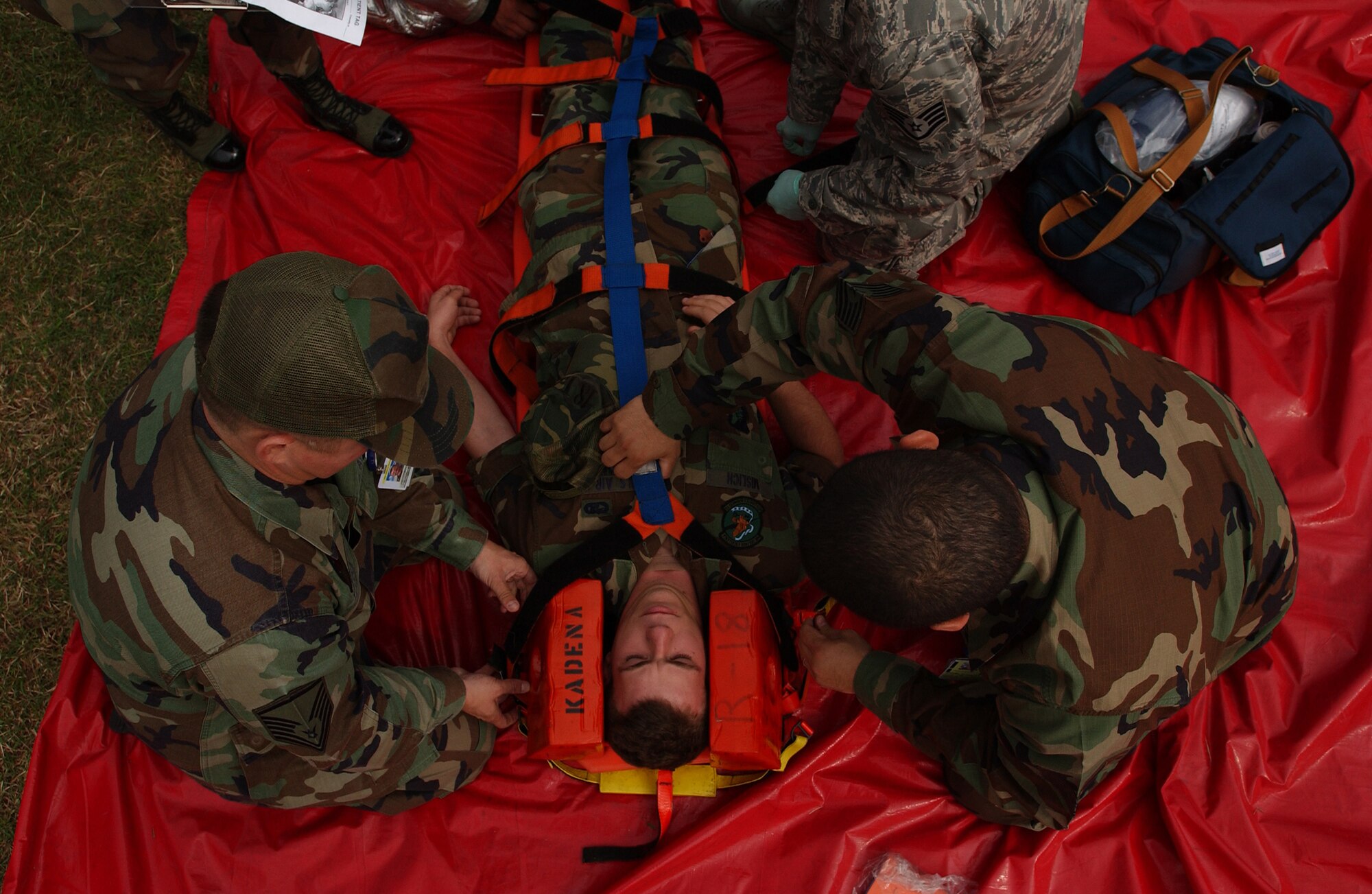 Airmen from the 18th Medical Operations Squadron stabilize a victim before sending him to the emergency room during a simulated collision of a van with a fuel truck at Kadena Air Base, Japan, Dec. 3, 2007. This exercise helps medical technicians train for possible real-world scenarios on injured victims during the Local Operational Readiness Exercise Beverly High 08-2.
(U.S. Air Force photo/Tech. Sgt. Rey Ramon)
