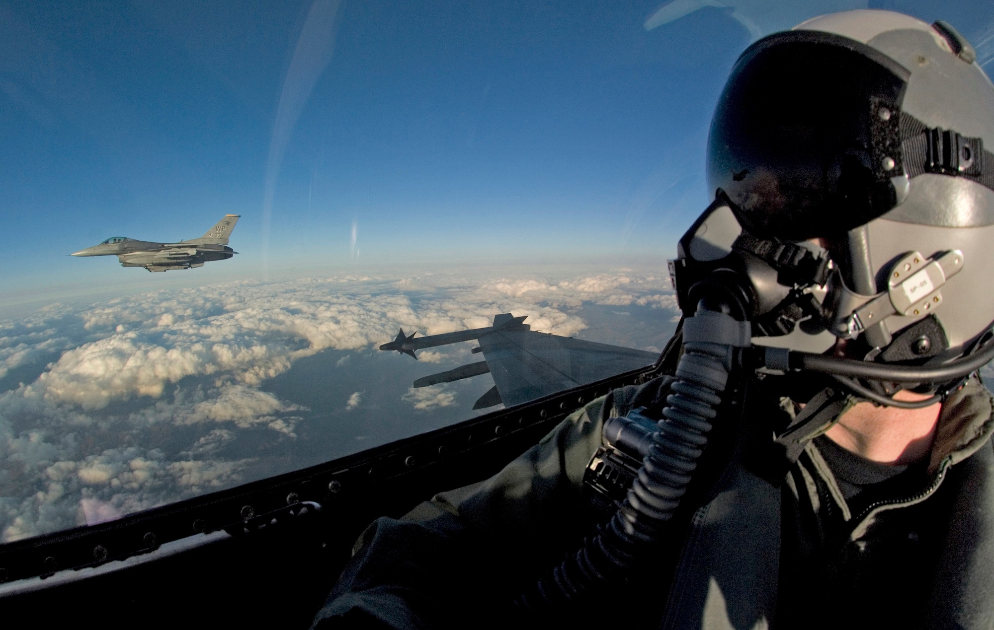 F-16 Fighting Falcons from the 80th Fighter Squadron at Kunsan Air Base, South Korea, join up for a post-mission safety check before returning to base Nov. 29. The aircraft were part of a close-air-support training mission over a designated training area. (U.S. Air Force Photo/Master Sgt Jack Braden)