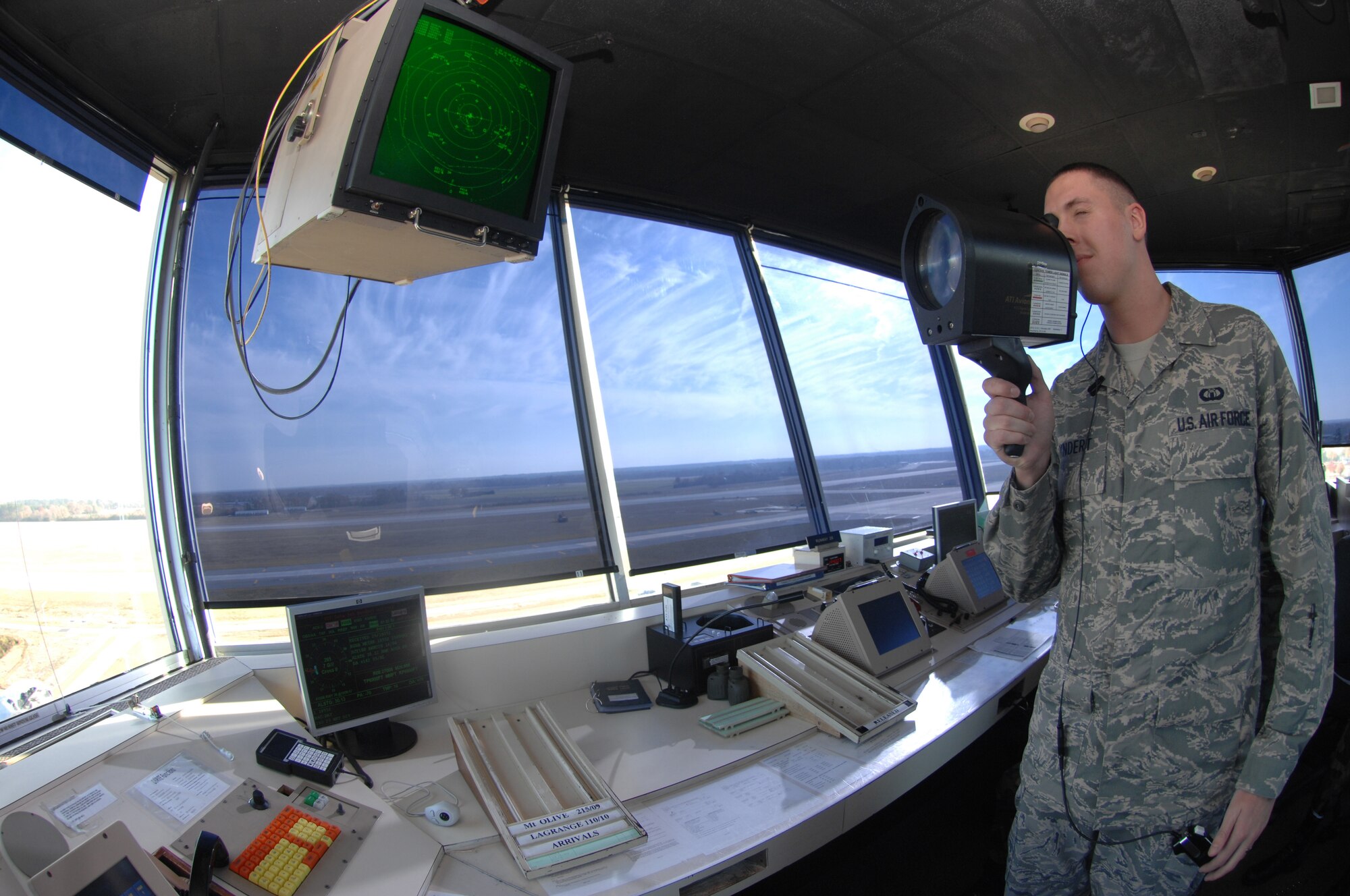 Airman First Class (A1C) James Bindert, an Air Traffic Controller from the 4th Operations Support Squadron, looks through a light gun on November 29, 2007 at Seymour Johnson AFB, North Carolina.  A1C Bindert demonstrates the use of a light gun, to communicate with the pilots incase of a radio failure.

(US Air Force photo by Airman First Class Salma Din)(Released)