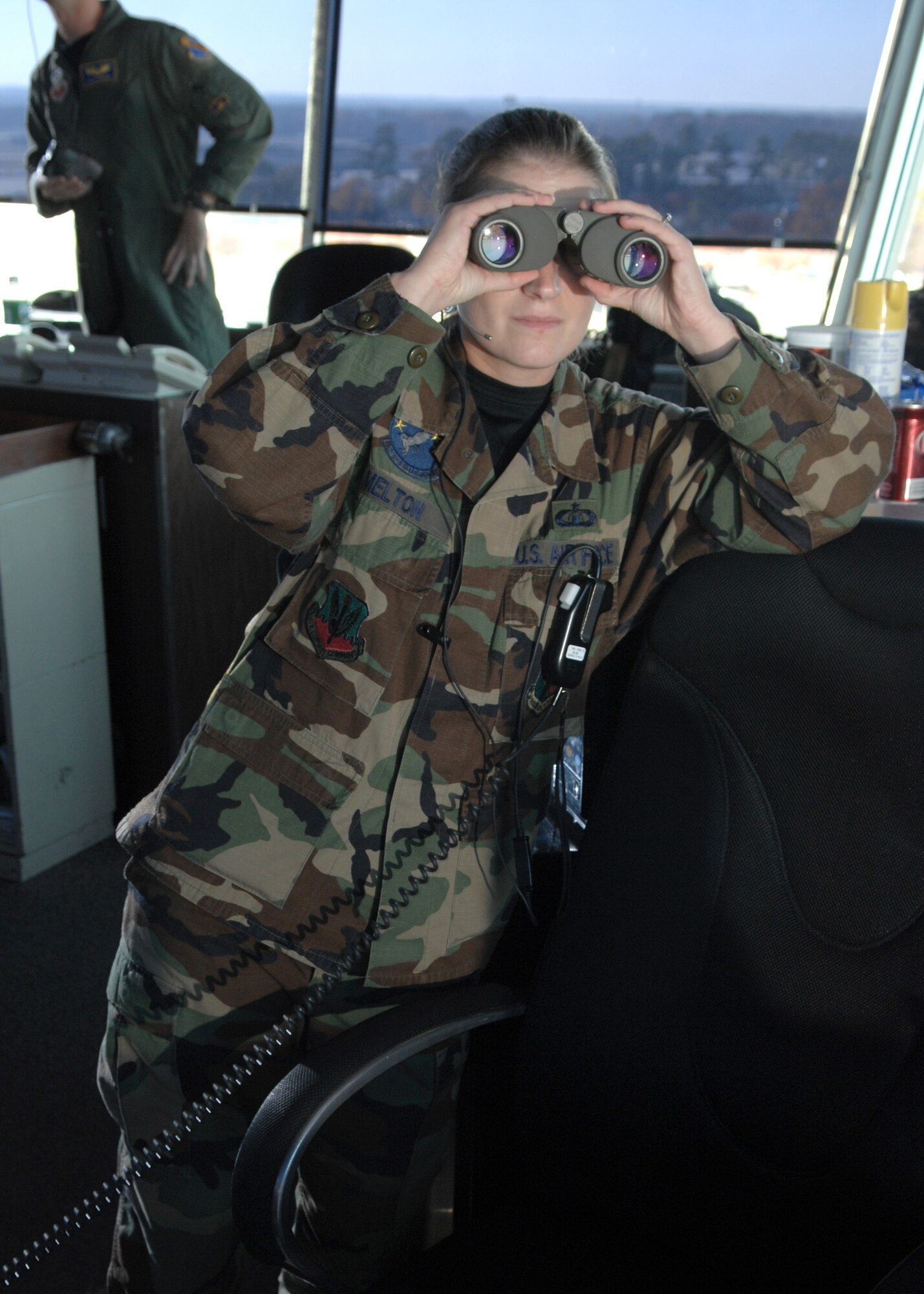 Staff Sergeant Camilla Melton, Watch Supervisor from the 4th Operations Support Squadron, looks for birds or any other objects in the path of the aircraft flight on November 29, 2007 at Seymour Johnson AFB, North Carolina.  Air Traffic Controllers have a huge responsibility on being the pilots ?second eye? in making sure they will have a safe flight and nothing will harm them or vice versa. 

(US Air Force photo by Airman First Class Salma Din)(Released)
