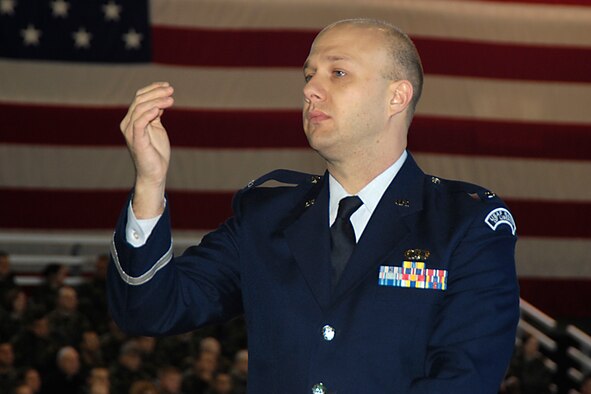 HANSCOM AIR FORCE BASE, Mass. -- Air Force Band of Liberty Commander 1st Lt. Dave Alpar conducts a musical piece during the Electronic Systems Center change of command ceremony Nov. 7. The lieutenant has been assigned to Hanscom for a little more than a month; he described his duty as being the “best on earth.” (U.S. Air Force photo by Linda LaBonte Britt)  