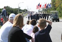 A crowd watches as the 2007 Holiday Parade passes Dec. 1 at Kadena Air Base, Japan. The parade featured numerous organizations and kicked off the Tinsel Town celebration at the Schilling Community Center. 
