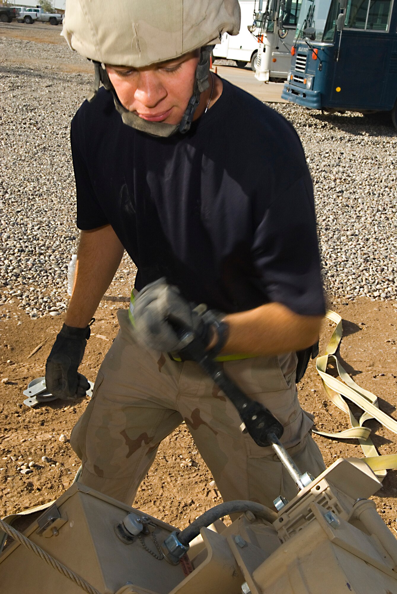 BALAD AIR BASE, Iraq -- Senior Airman Brad Hellberg a 332nd Expeditionary Civil Engineer Squadron mobile team member, removes a winch from a Basic Expeditionary Airfield Resources dome shelter here, Dec. 3. The winch is used to open and close the door of the shelter. Airman Hellberg is deployed from Holloman Air Force Base, N.M. (U.S. Air Force photo/Staff Sgt. Joshua J. Garcia) 