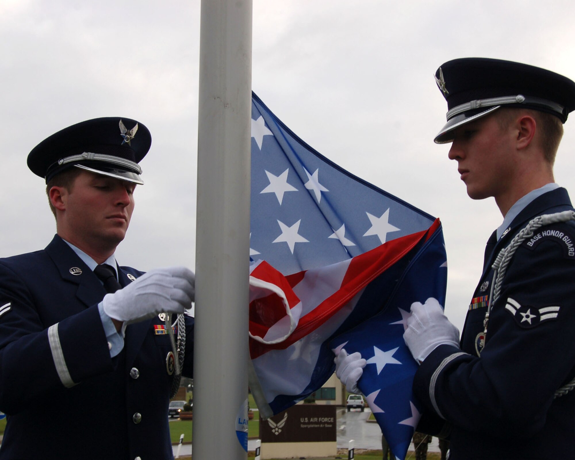 SPANGDAHLEM AIR BASE, Germany -- Members from the 52nd Fighter Wing Honor Guard raise an American flag over a newly constructed traffic circle outside the Spangdahlem Air Base main gate Nov. 26, 2007. (U.S. Air Force photo/Staff Sgt. Chris Mills)