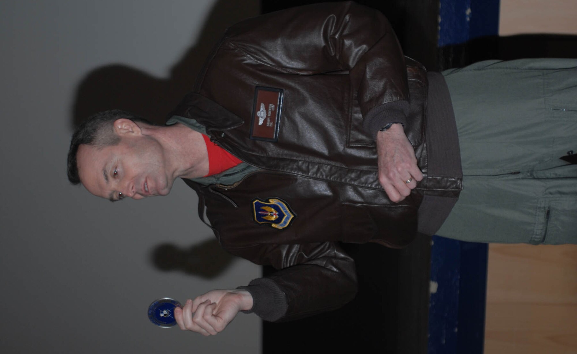 SPANGDAHLEM AIR BASE, Germany –Col. Darryl Roberson, 52nd Fighter Wing commander, talks to members of the 52nd Security Forces Squadron before returning their Saber Choices coin. The coin signifies that the unit has gone 52 days without any driving while under the influence or alcohol related incidents. (U.S. Air Force photo/Airman 1st Class Jennifer Calhoun)