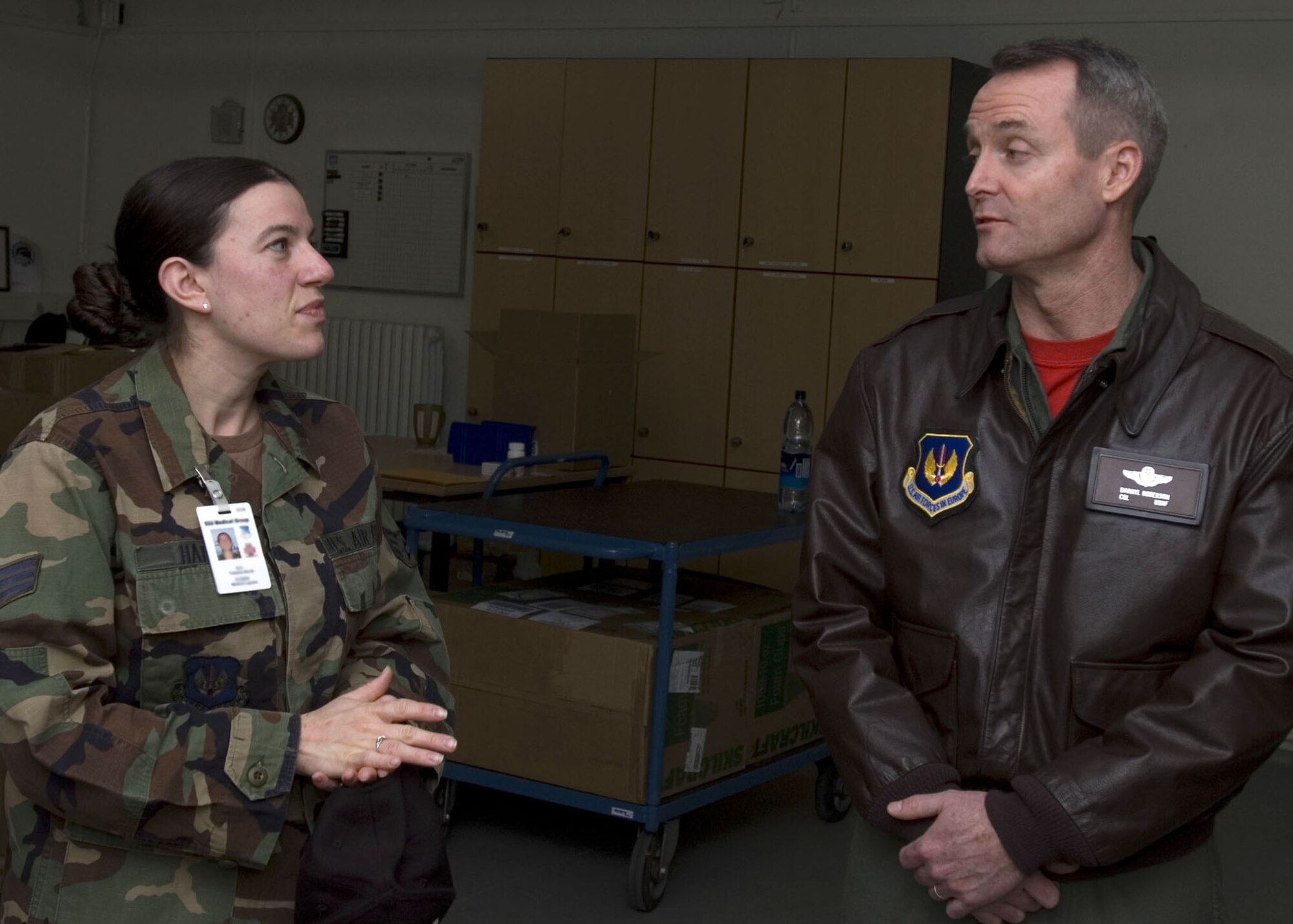 SPANGDAHLEM AIR BASE, Germany – Senior Airman Vanessa Harsh, 52nd Medical Support Squadron acquisition technician, explains the base’s medical supply mission to Col. Darryl Roberson, 52nd Fighter Wing commander, as she is shadowed by the commander Nov. 30. Airman Harsh is a native of Burkburnett, Texas. She is currently attending college to achieve her degree in health administration. (U.S. Air Force photo/Staff Sgt. Chris Mills)