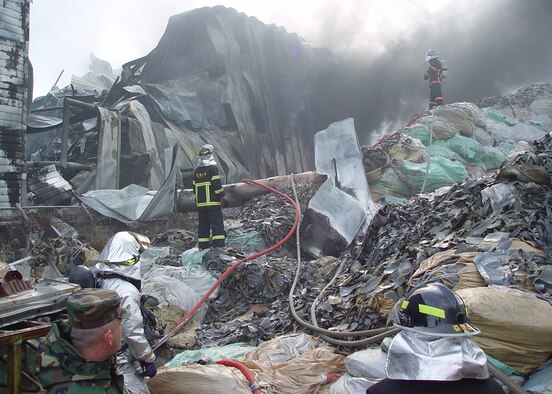 GUNSAN CITY, South Korea — Gunsan City firefighters and 8th Civil Engineer Squadron firefighters, diminished a fire here Dec. 3. Members of the 8th CES fire department, work together with local fire departments to put out a large industrial fire. (U.S. Air Force Photo/Tech. Sgt. Jason Rosenbaum)