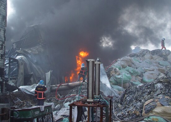 GUNSAN CITY, South Korea — Gunsan City firefighters control fire here Dec. 3. Members of the 8th Civil Engineer Squadron fire department work together with local community fire departments to put out a large industrial fire. (U.S. Air Force photo/ Tech. Sgt. Jason Rosenbaum)