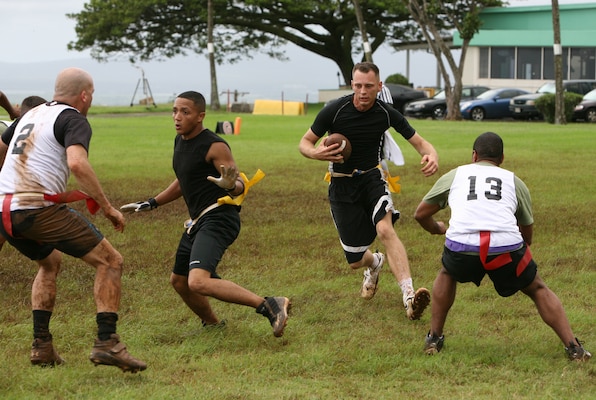Douglas Dixon, Marauders quarterback, runs the ball up the sideline with a block from teammate Jacob McFarland, running back, to gain the first down during an intramural flag football game at Bordelon Field, Dec. 4.