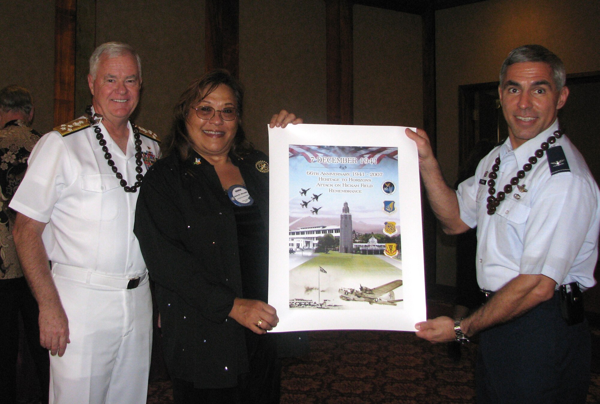 Col Torres (right) presented a Dec 7th Commemorative Poster to Dona McLaughlin, President of Rotary Club of Pearl Harbor, at Heroes  luncheon; (left) Admiral Keating, Commander of the U.S. Pacific Command.  

