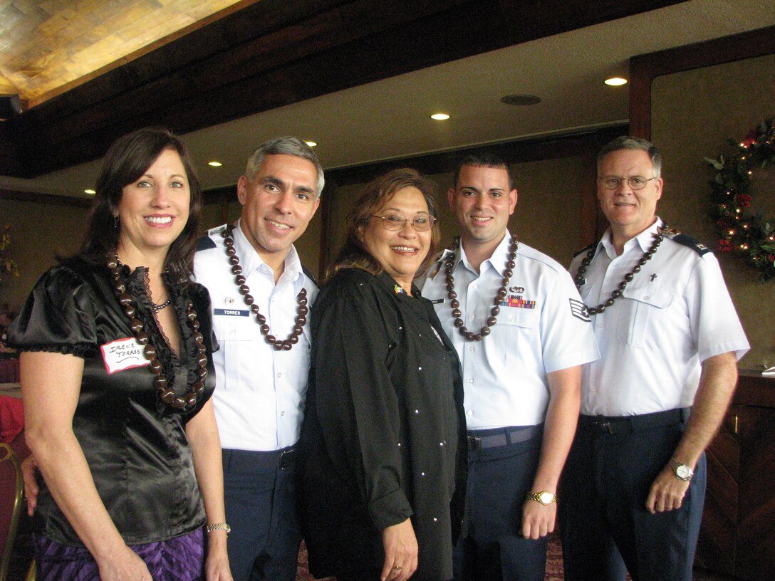 Posed with Hickam Heroes, Capt Parrish, 15th Airlift Wing Chapel Center (right), SSgt Torres, 15th Maintenance Operations Center Controller, Mrs. Dona McLaughlin, President of Rotary Club of Pearl Harbor, Colonel Torres, 15th Airlift Wing Commander and his wife Irene Torres.