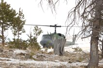 A UH-1N Huey helicopter from the 40th Helicopter Squadron lands just outside a wooded area near the Rocky Mountain Front during a search and rescue training sortie Nov. 19. (U.S. Air Force photo/Senior Airman Eydie Sakura).
