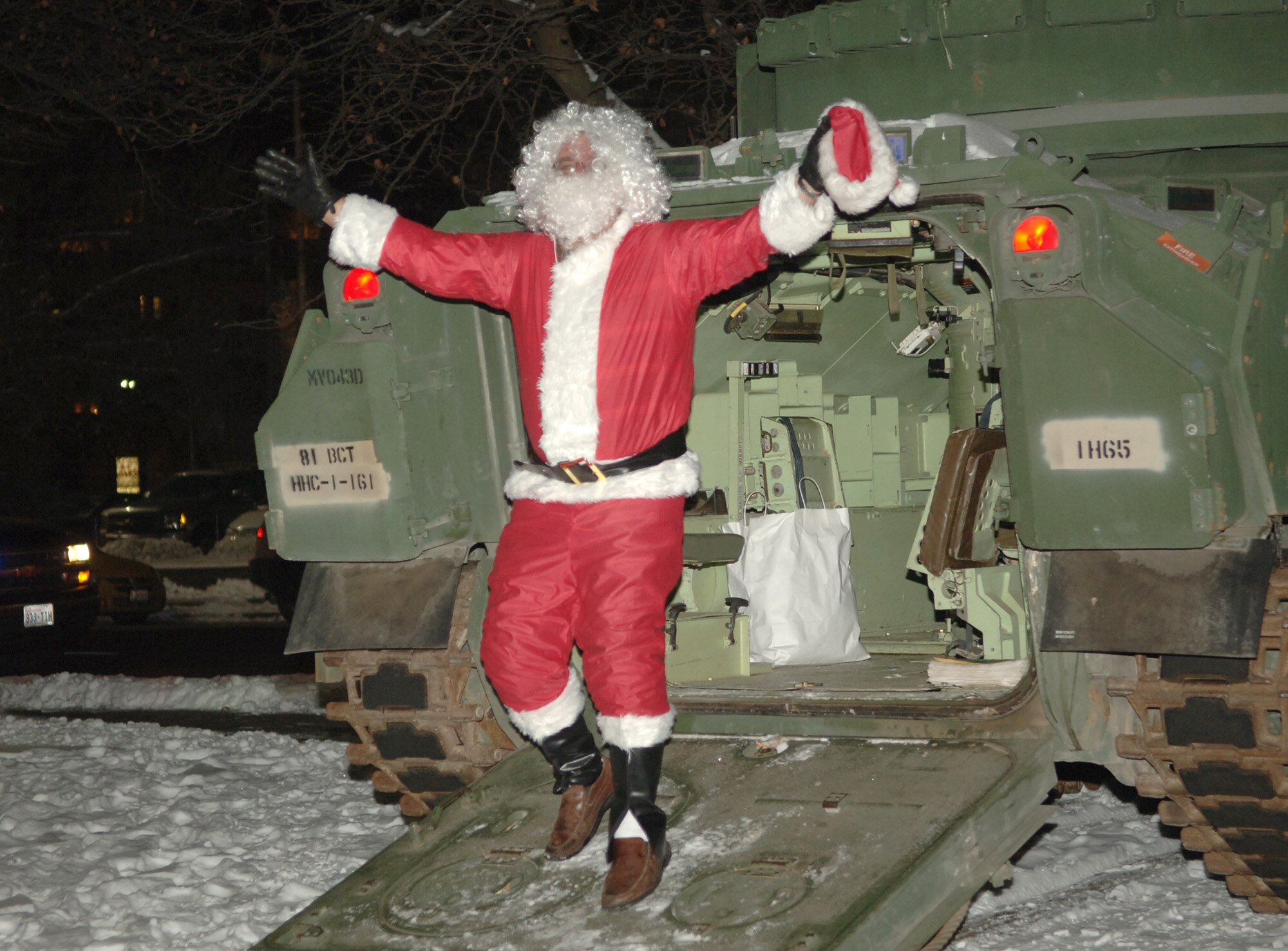 FAIRCHILD AIR FORCE BASE, Wash. – Santa Claus arrives at Riverfront Park in downtown Spokane on Nov. 30 in a Bradley Fighting Vehicle. Operation Spokane Heroes hosted a holiday party for families of deployed military members from the local area; children got to visit with Santa, ride the carrousel and enjoy pizza as part of the festivities. (U.S. Air Force photo by Airman 1st Class Jocelyn A. Ford)