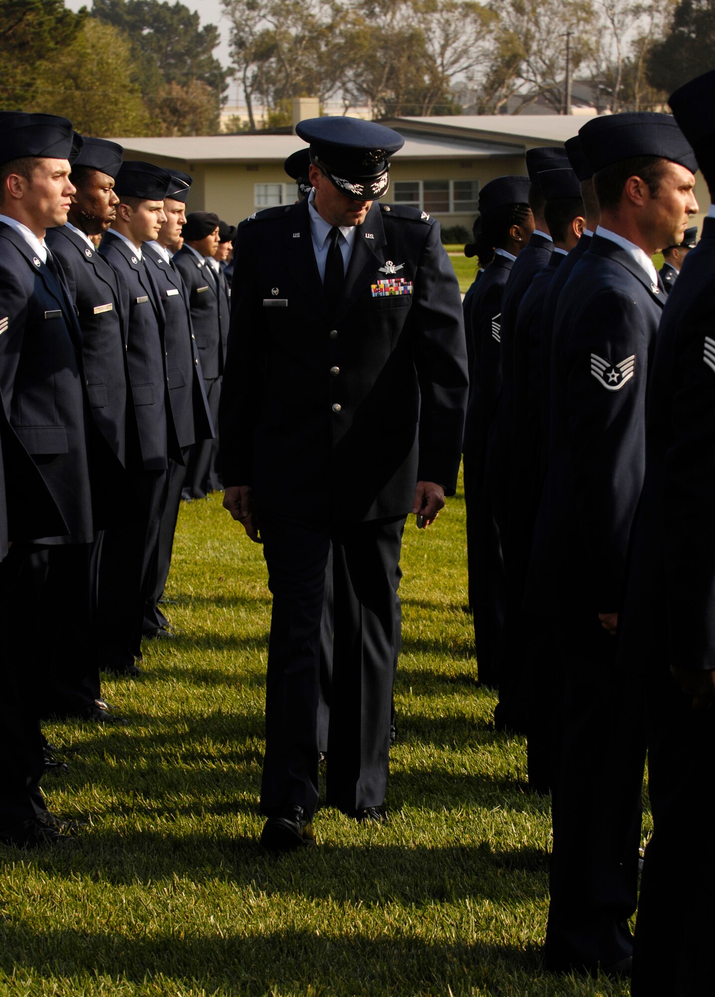 VANDENBERG AIR FORCE BASE, Calif. -- Col. Benjamin Huff, 30th Mission Support Group Commander, conducts an open ranks inspection prior to a retreat ceremony on Oct. 25. 30th Mission Support Group Airmen supported the time honored open ranks inspection. Air Force Instruction 36-2903 directs the wear of uniforms, insignias, awards and decorations. Airmen of all ranks are required to have all uniform items ready to wear at any time. (U.S. Air Force photo/Airman 1st Class Christian Thomas) 
