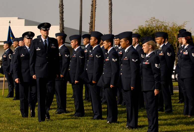 VANDENBERG AIR FORCE BASE, Calif. -- Col. Benjamin Huff, 30th Mission Support Group Commander, conducts an open ranks inspection prior to a retreat ceremony on Oct. 25. 30th Mission Support Group Airmen supported the time honored open ranks inspection. Air Force Instruction 36-2903 directs the wear of uniforms, insignias, awards and decorations. Airmen of all ranks are required to have all uniform items ready to wear at any time. (U.S. Air Force photo/Airman 1st Class Christian Thomas) 