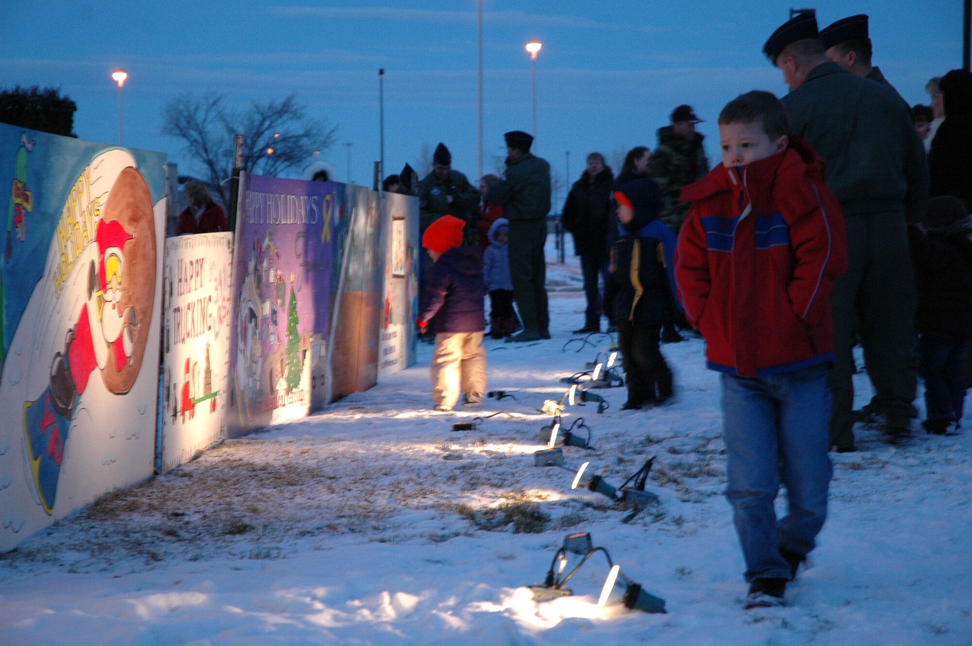 Airmen and their families attend the annual tree-lighting ceremony at the Grizzly Bend Club Nov. 29. A holiday card contest was also held. The 341st Medical Operations Group won first place, the 341st Mission Support Squadron took second, and the 341st Comptroller Squadron came in third. (U.S. Air Force photo/Airman 1st Class Dillon White)