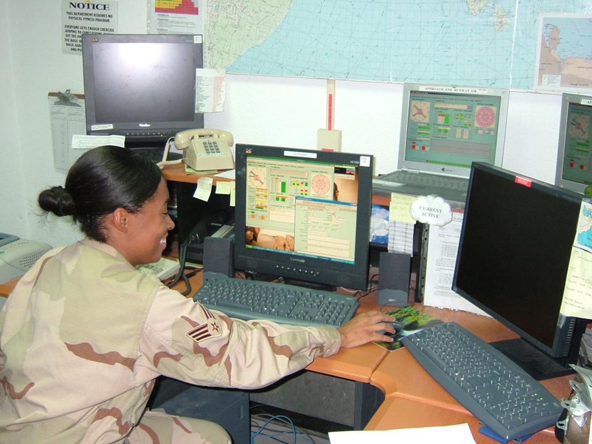 HANSCOM AFB, Mass -- Senior Airman Kimberly Stukes, operating at a deployed location, accesses some of the new weather products recently delivered by Electronic Systems Center’s 651st Electronic Systems Squadron and prepares to disseminate information to interested customers both on- and off-base. (Courtesy photo.)