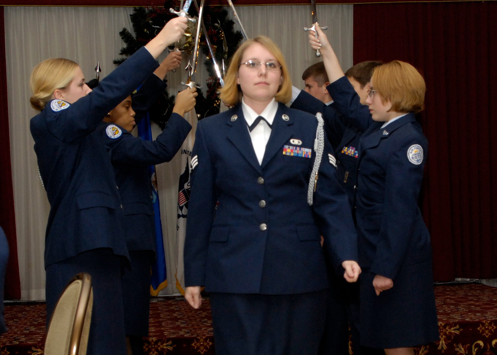 HANSCOM AFB, Mass. -- Senior Airman Jacqueline Bridges, Base Chapel, is introduced on stage, along with other Airman Leadership School students, during the Nov. 30 ALS graduation ceremony held at the Minuteman Club. ALS is a five-week course and the first step of Professional Military Education for all enlisted Airmen. The course is required to be taken in residence by active-duty servicemembers prior to being promoted to the rank of staff sergeant and is a requirement for all Airmen to be a rater on Enlisted Performance Reports. (U.S. Air Force photo by Mark Wyatt.)

