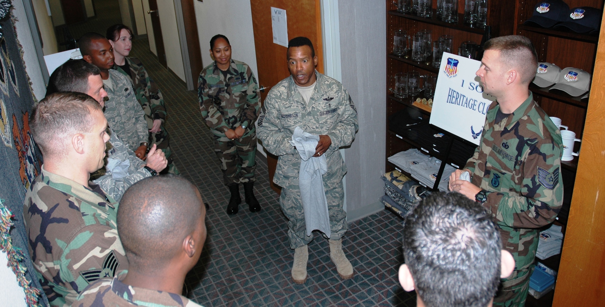 Chief Master Sgt. Jeffrey Richardson, 1st Special Operations Wing command chief, addresses the guests at the opening of the 1st SOW Heritage Closet.  From this closet, located on the second floor of Bldg. 90210, Hurlburt Field’s Focus 56 council sells blankets, hats, casual shirts, T-shirts and coins emblazoned with the 1st SOW shield.  All monies raised by heritage closet sales will return to the base through Focus 56’s many projects and donations. (U.S. Air Force photo/Master Sgt. Stuart Camp)
