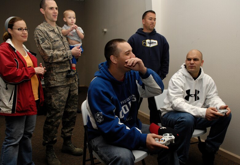 VANDENBERG AIR FORCE BASE, Calif. -- Spectators watch Staff Sgt. Steve Mize and Staff Sgt. Josh Craig, 4th Space Launch Squadron, compete in the Culture of Responsible Choices Halo 2 Tournament at the Vandenberg Center on Dec. 1. This was the first event CoRC has hosted on Vandenberg. The tournament was held in hopes that it would provide Airmen with an alternative to drinking on the weekend. The winners of the event were Tech. Sgt. Edward MacIntosh, Airman 1st Class Christian Thomas and Airman 1st Class Anthony Huffman. (U.S. Air Force photo/Airman 1st Class Christian Thomas)