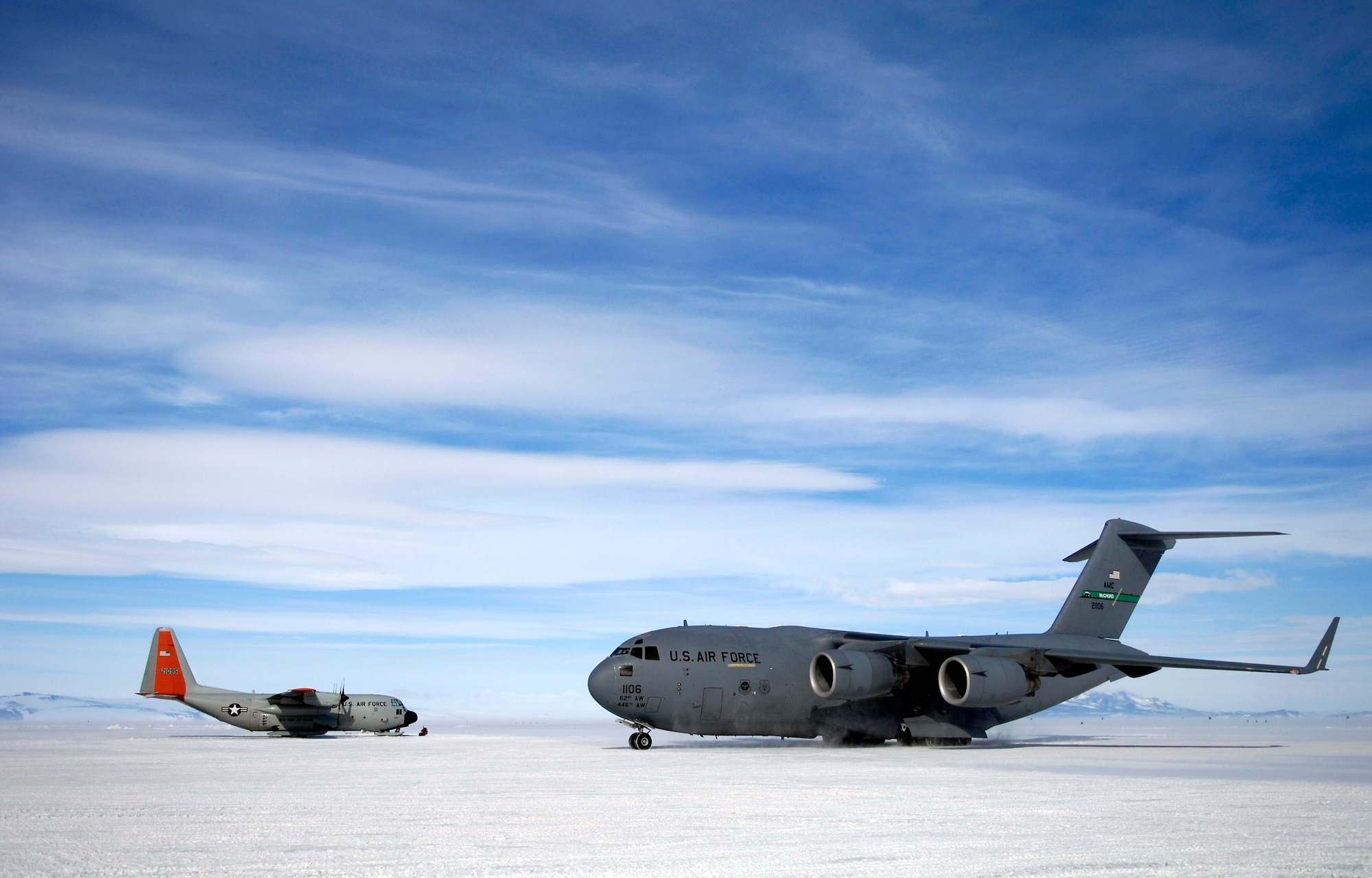 A C-17 Globemaster III taxis to its parking spot Nov. 27 on the ice runway at McMurdo Station, Antarctica, during Operation Deep Freeze. C-17s fly large cargo loads from Christchurch New Zealand to Antarctica while the LC-130 Hercules, stationed at McMurdo, fly smaller cargo loads to research posts throughout the continent. The C-17s from McChord Air Force Base, Wash., and ski-equipped LC-130s from the New York Air National Guard's 109th Airlift Wing are supporting the 13th Air Force-led Joint Task Force Support Forces Antarctica operation. (U.S. Air Force photo/Tech. Sgt. Shane A. Cuomo) 