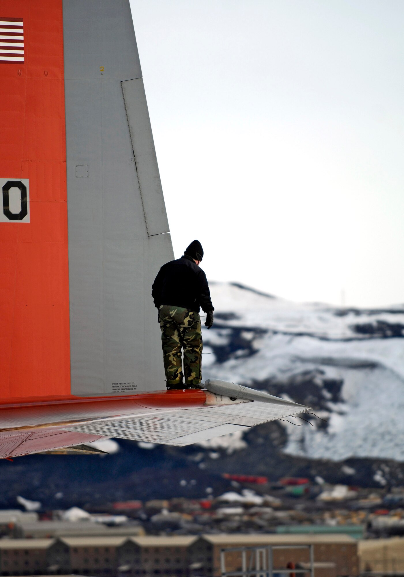 Tech. Sgt. Tammy Kirwan conducts a post flight check of an LC-130 Hercules Nov. 27 on the ice runway near McMurdo Station, Antarctica, during Operation Deep Freeze. Ski-equipped LC-130s, crews and support personnel from the New York Air National Guard's 109th Airlift Wing are supporting the 13th Air Force-led Joint Task Force Support Forces Antarctica, Operation Deep Freeze. (U.S. Air Force photo/Tech. Sgt. Shane A. Cuomo) 
