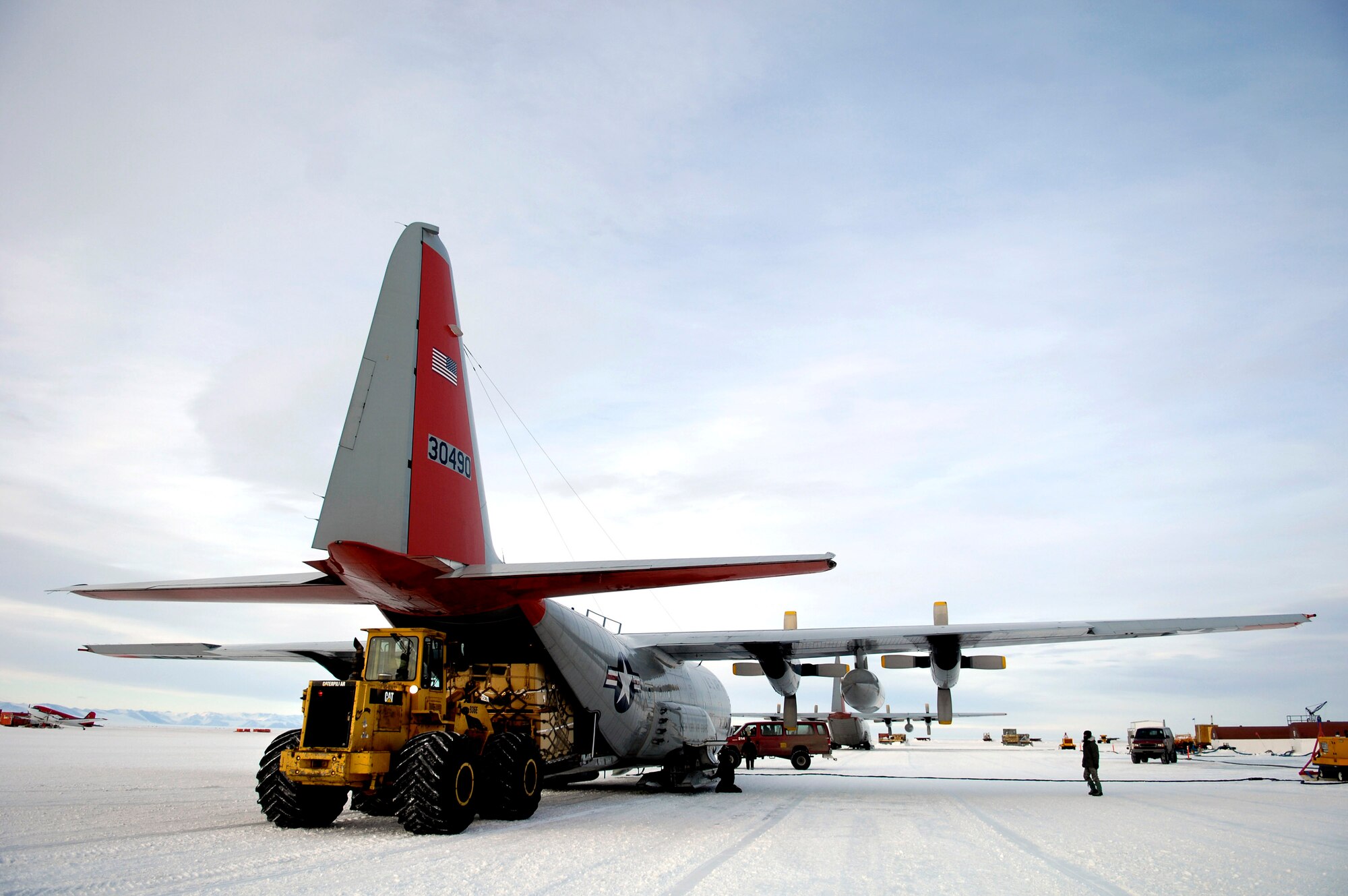 An LC-130 Hercules is unloaded Nov. 27 on the ice runway near McMurdo Station, Antarctica, during Operation Deep Freeze. Ski-equipped LC-130s, crews and support personnel from the New York Air National Guard's 109th Airlift Wing are supporting the 13th Air Force-led Joint Task Force Support Forces Antarctica, Operation Deep Freeze. Operation Deep Freeze is a unique mission that supports the National Science Foundation and U.S. Antarctic Program. (U.S. Air Force photo/Tech. Sgt. Shane A. Cuomo) 