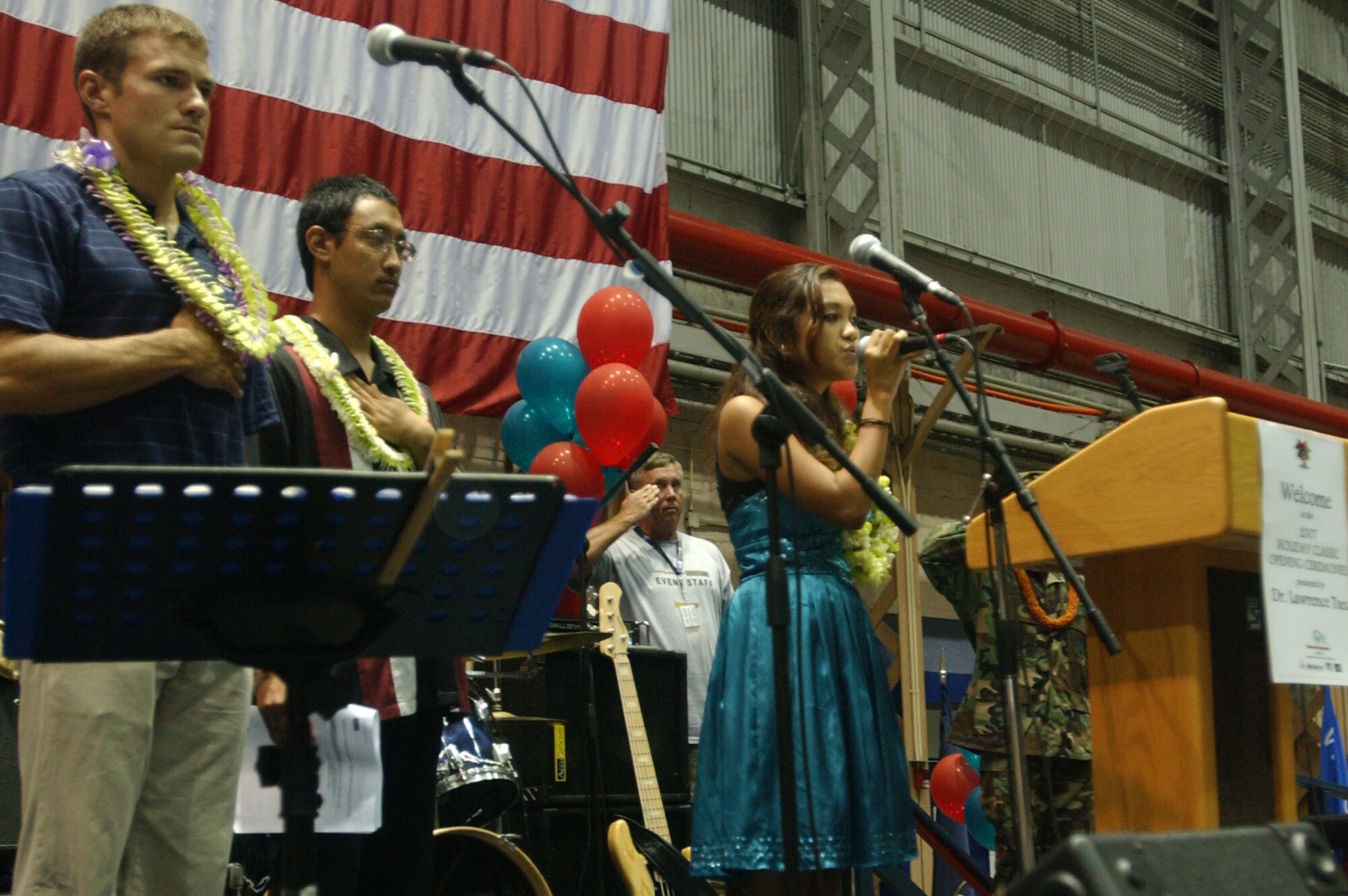 Brittney Mendoza sings the National Anthem at the Special Olympics Holiday Classic Opening Ceremony, Nov. 30. Photo by Staff Sgt. Erin Smith