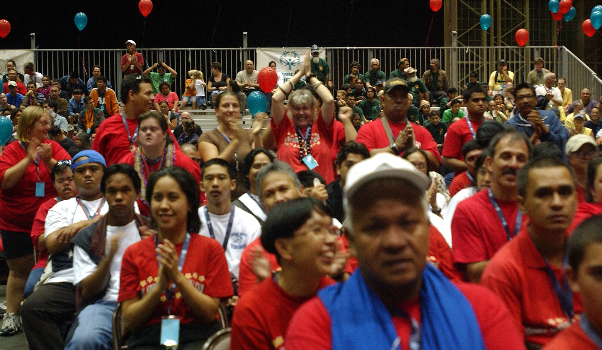 Athletes show their enthusiasm as the torch is lit at the Special Olympic Opening ceremonies here, Nov. 30. 